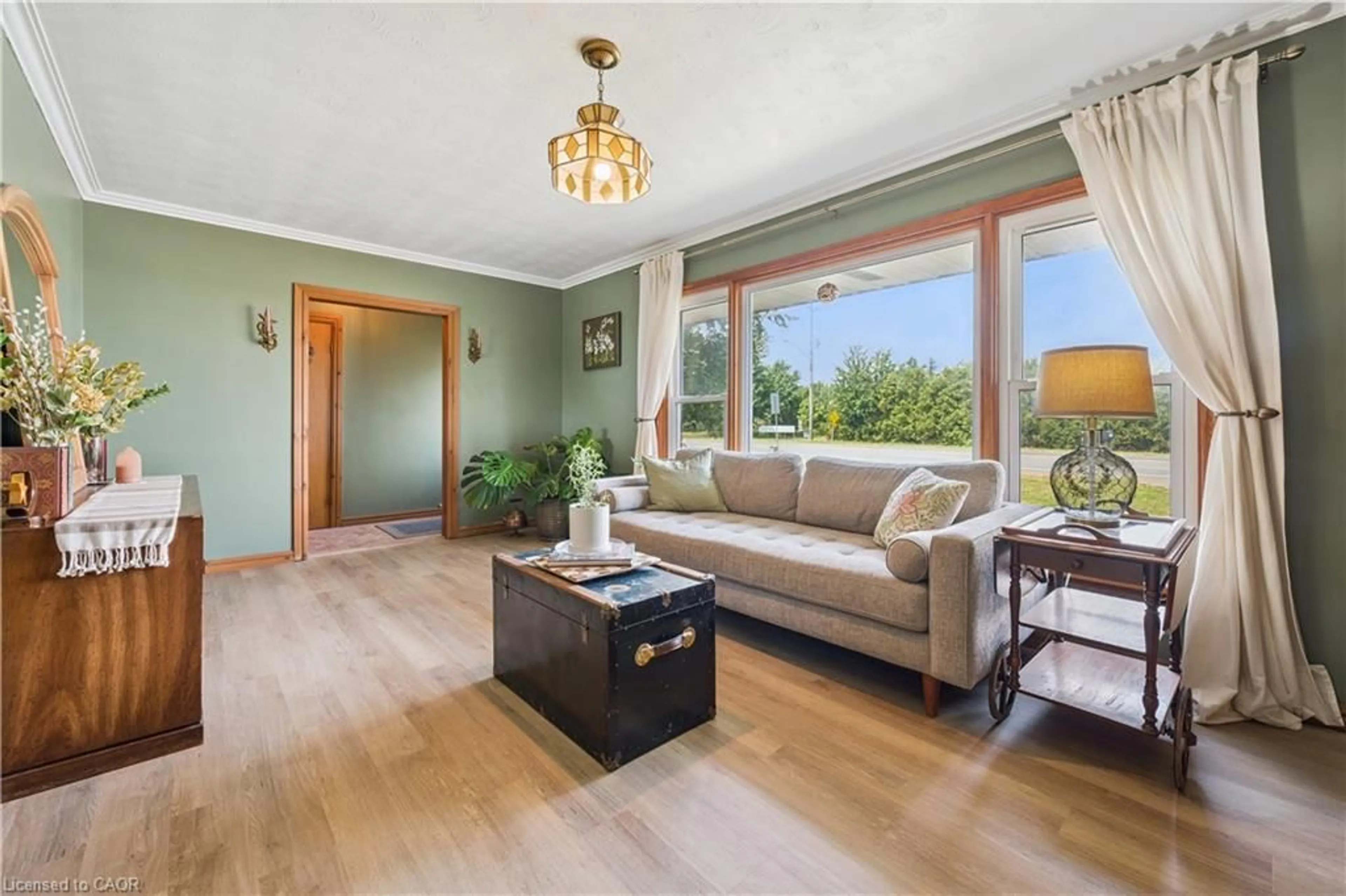Living room with furniture, wood/laminate floor for 1065 Erie St, Stratford Ontario N5A 6S4