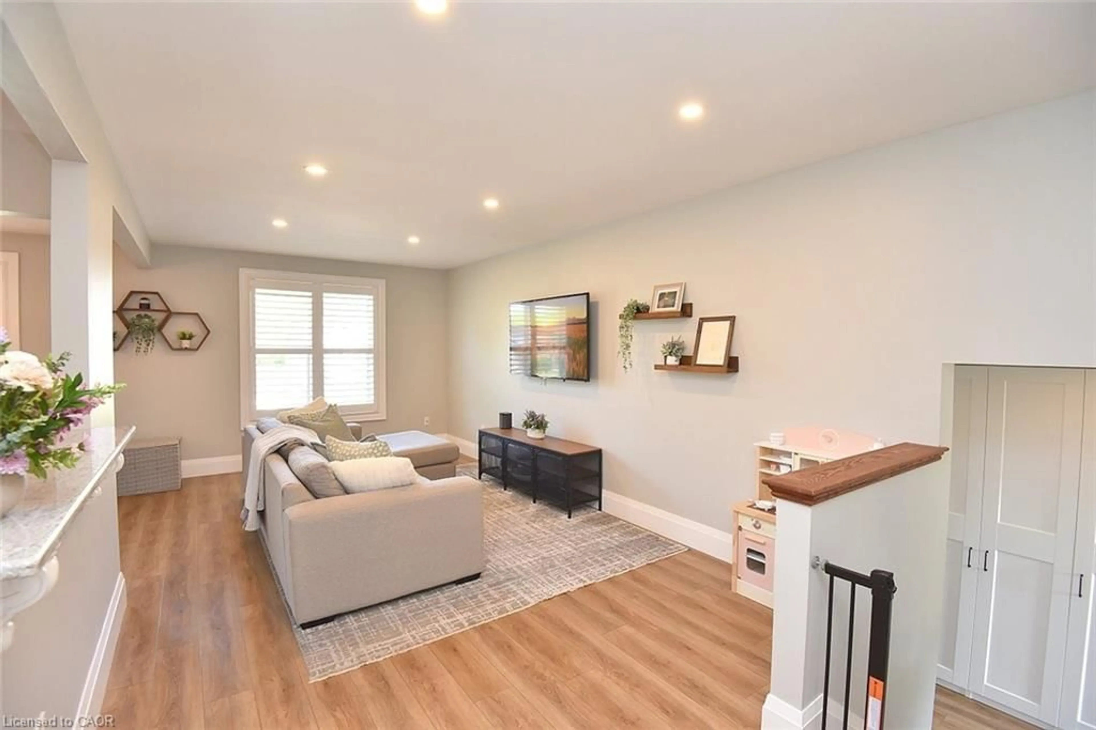 Living room with furniture, wood/laminate floor for 30 Scott St, St. George Ontario N0E 1N0