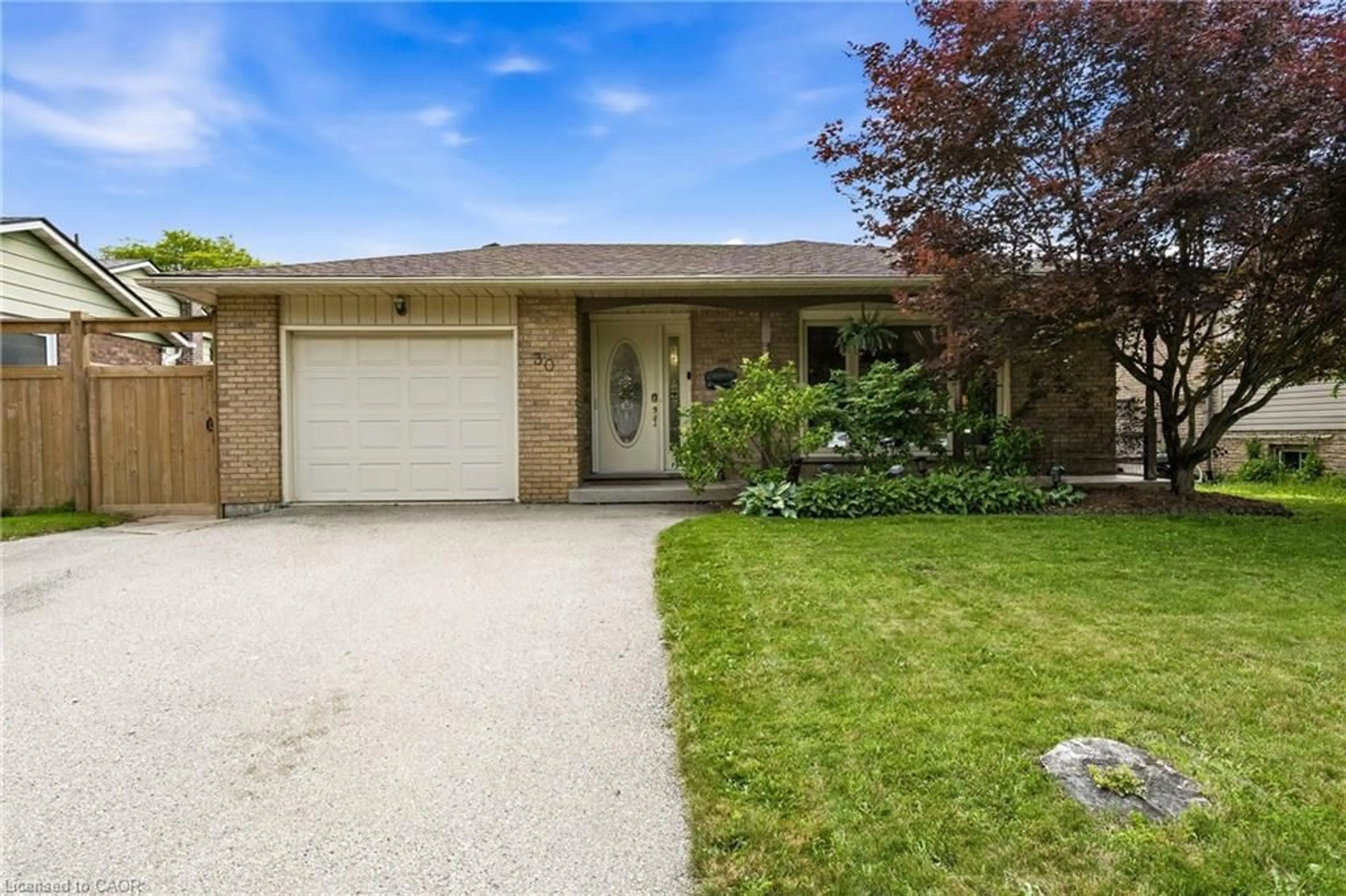 Home with brick exterior material, street for 30 Greenwood Trail, Brantford Ontario N3R 6G5