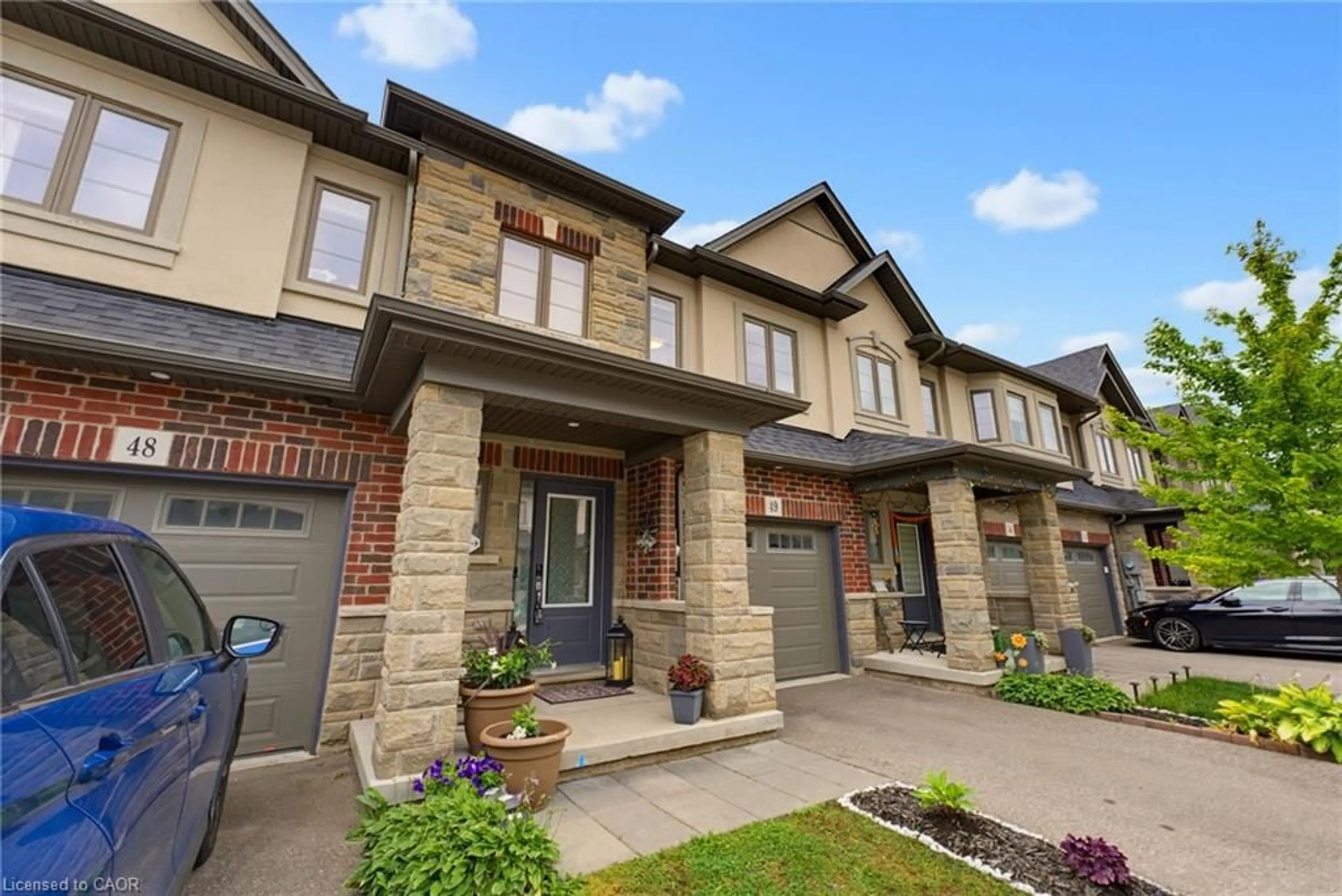 Home with brick exterior material, street for 324 Equestrian Way #49, Cambridge Ontario N3E 0E2