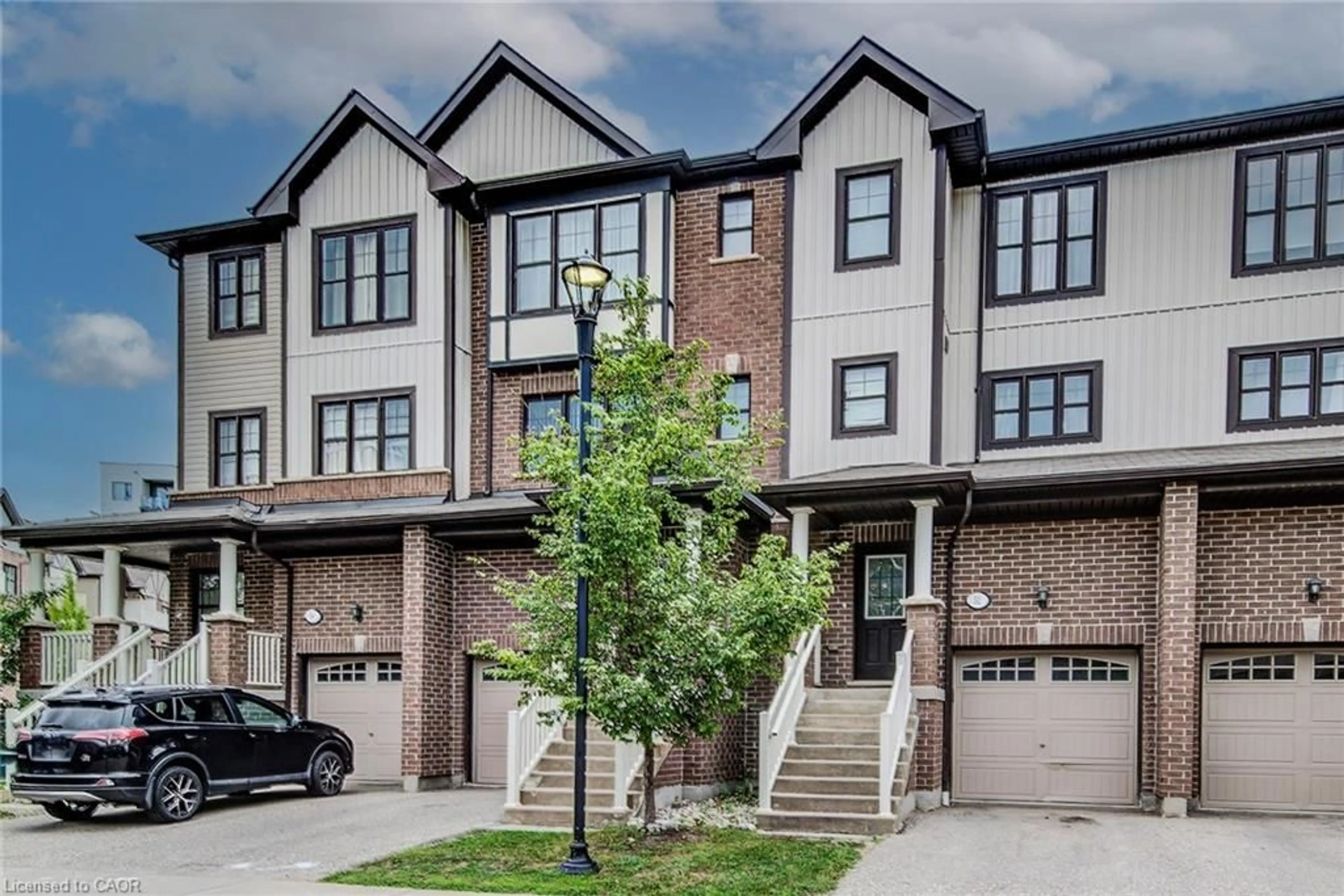 Home with brick exterior material, street for 701 Homer Watson Blvd #53, Kitchener Ontario N2C 0B5