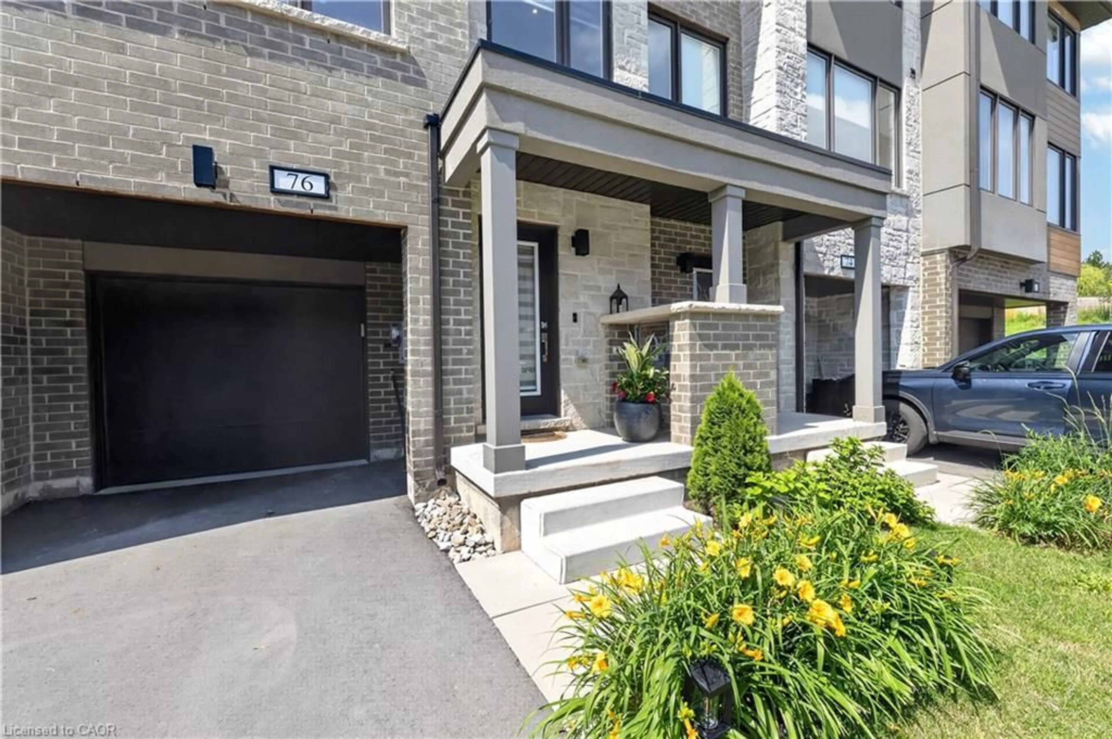 Home with brick exterior material, street for 76 Windtree Way, Georgetown Ontario L7G 0P6