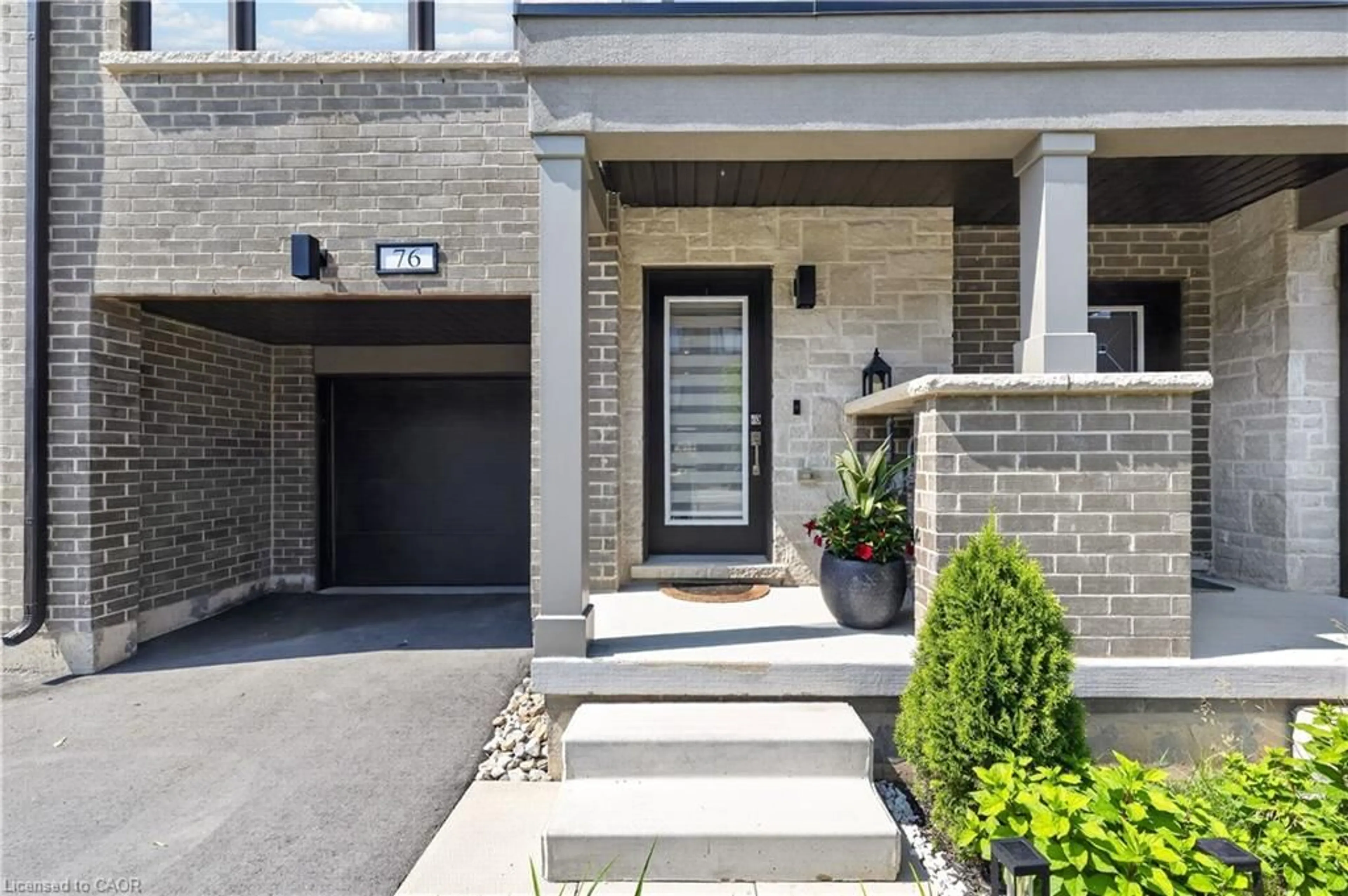 Home with brick exterior material, street for 76 Windtree Way, Georgetown Ontario L7G 0P6