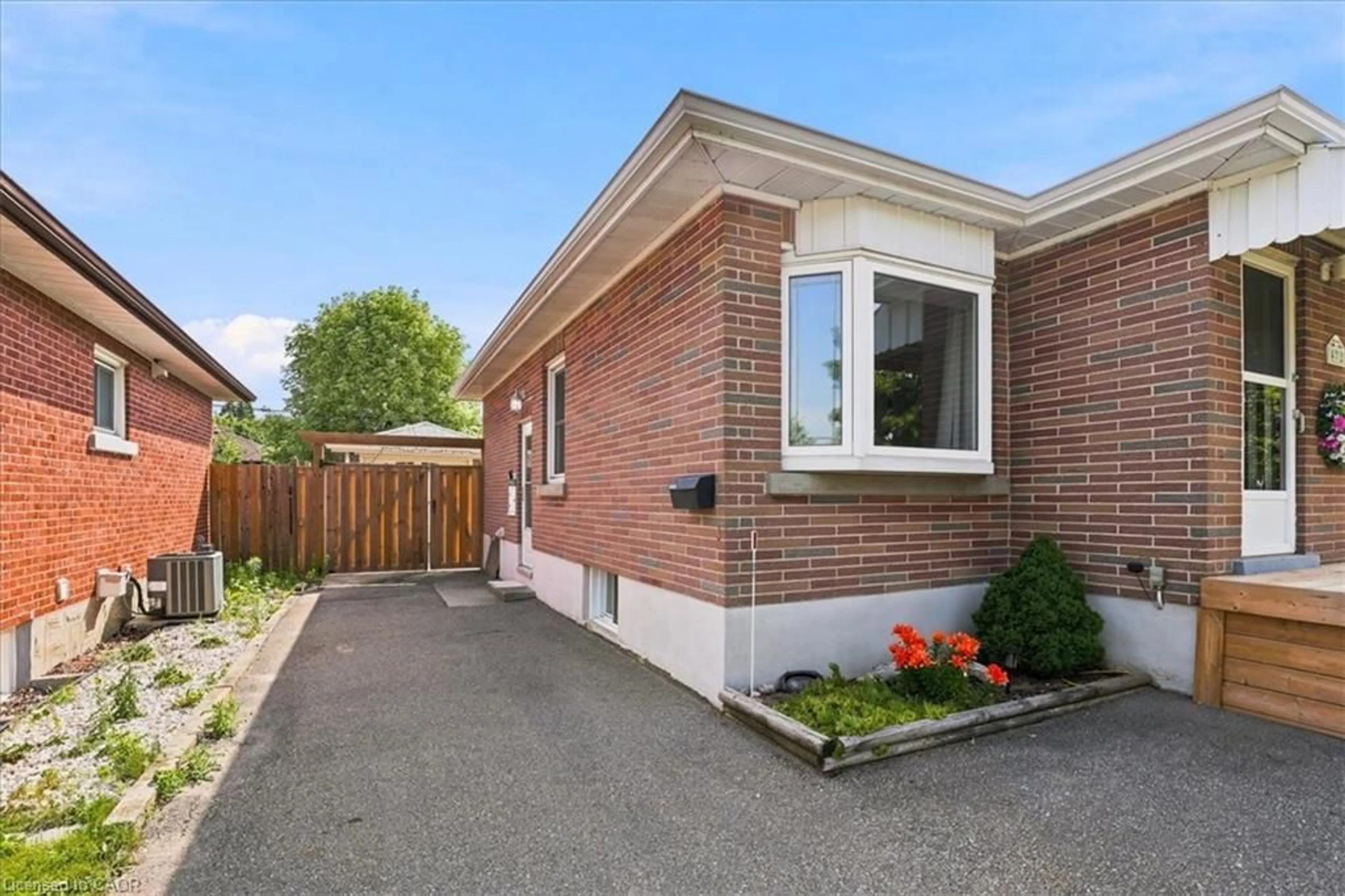 Home with brick exterior material, street for 472 Highland Rd, Kitchener Ontario N2M 3W7