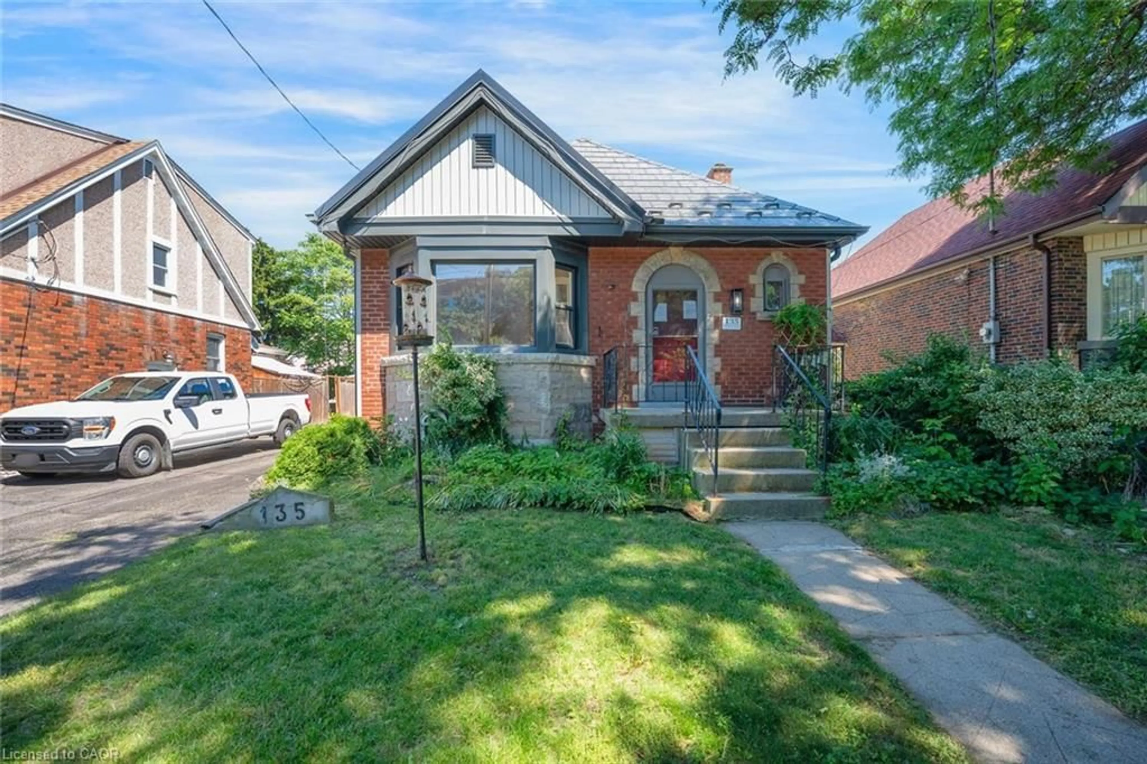 Home with brick exterior material, street for 135 Wexford Ave, Hamilton Ontario L8K 2N9