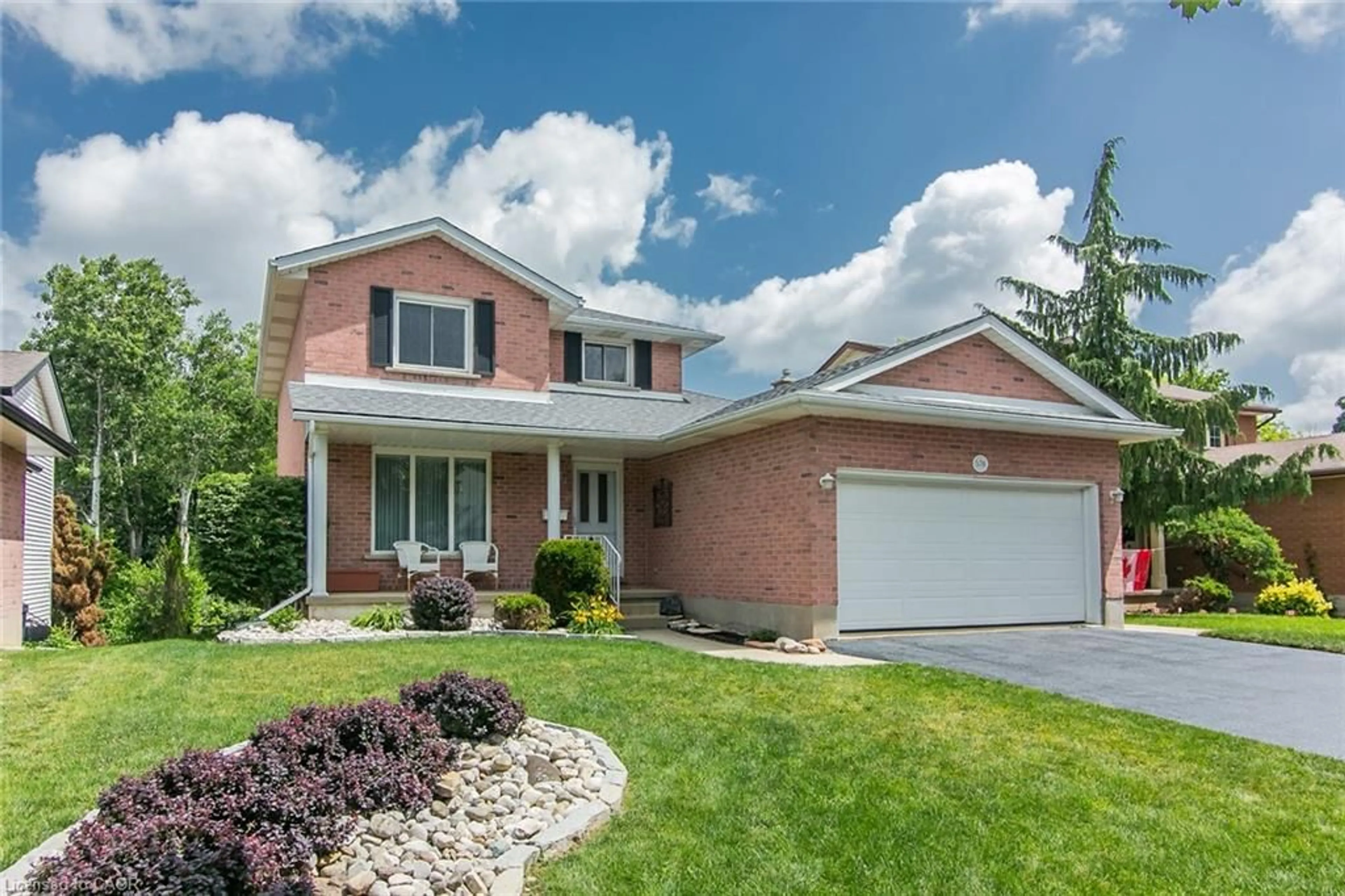 Home with brick exterior material, street for 570 Hallmark Dr, Waterloo Ontario N2K 3P2