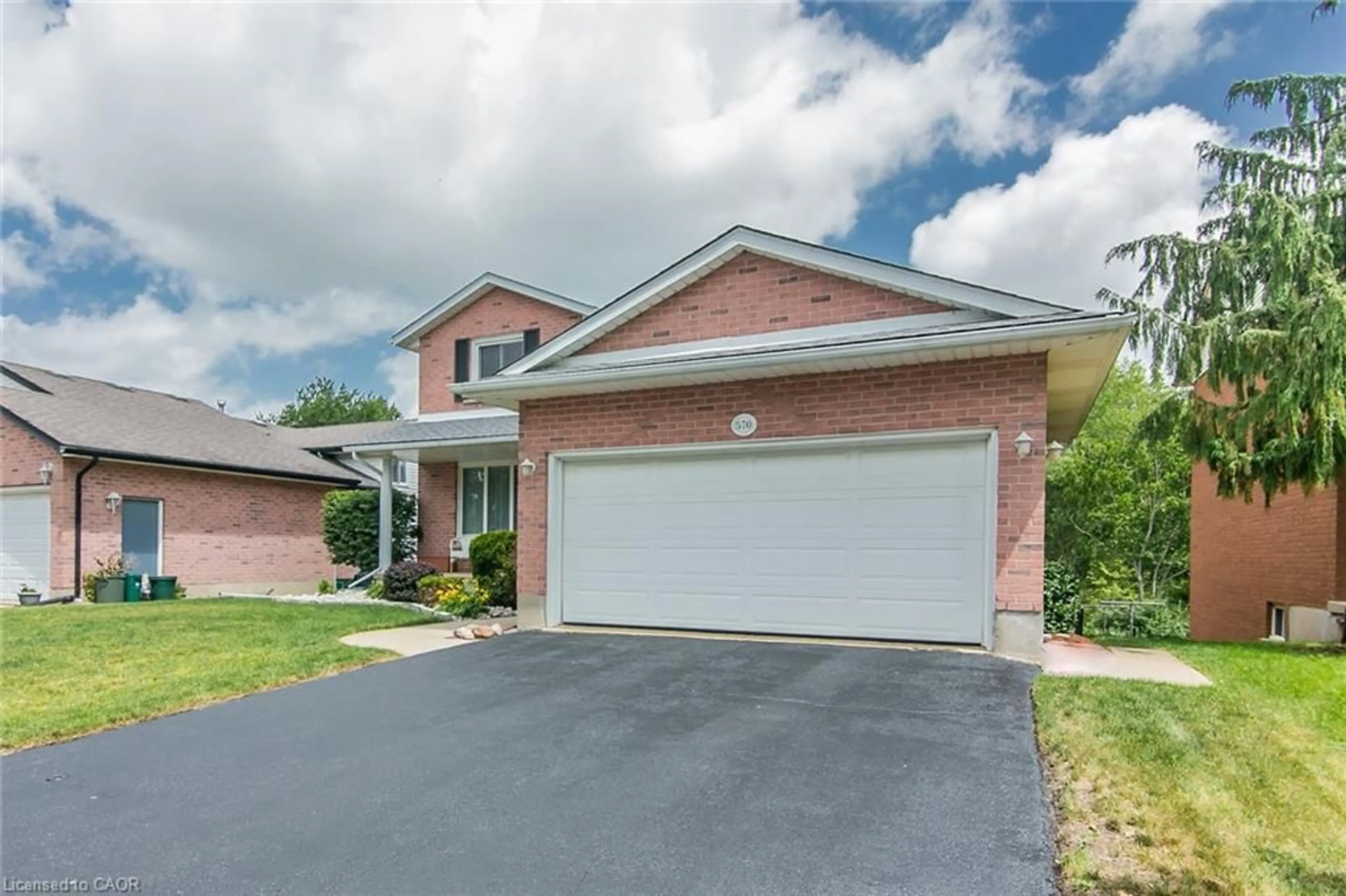 Home with brick exterior material, street for 570 Hallmark Dr, Waterloo Ontario N2K 3P2