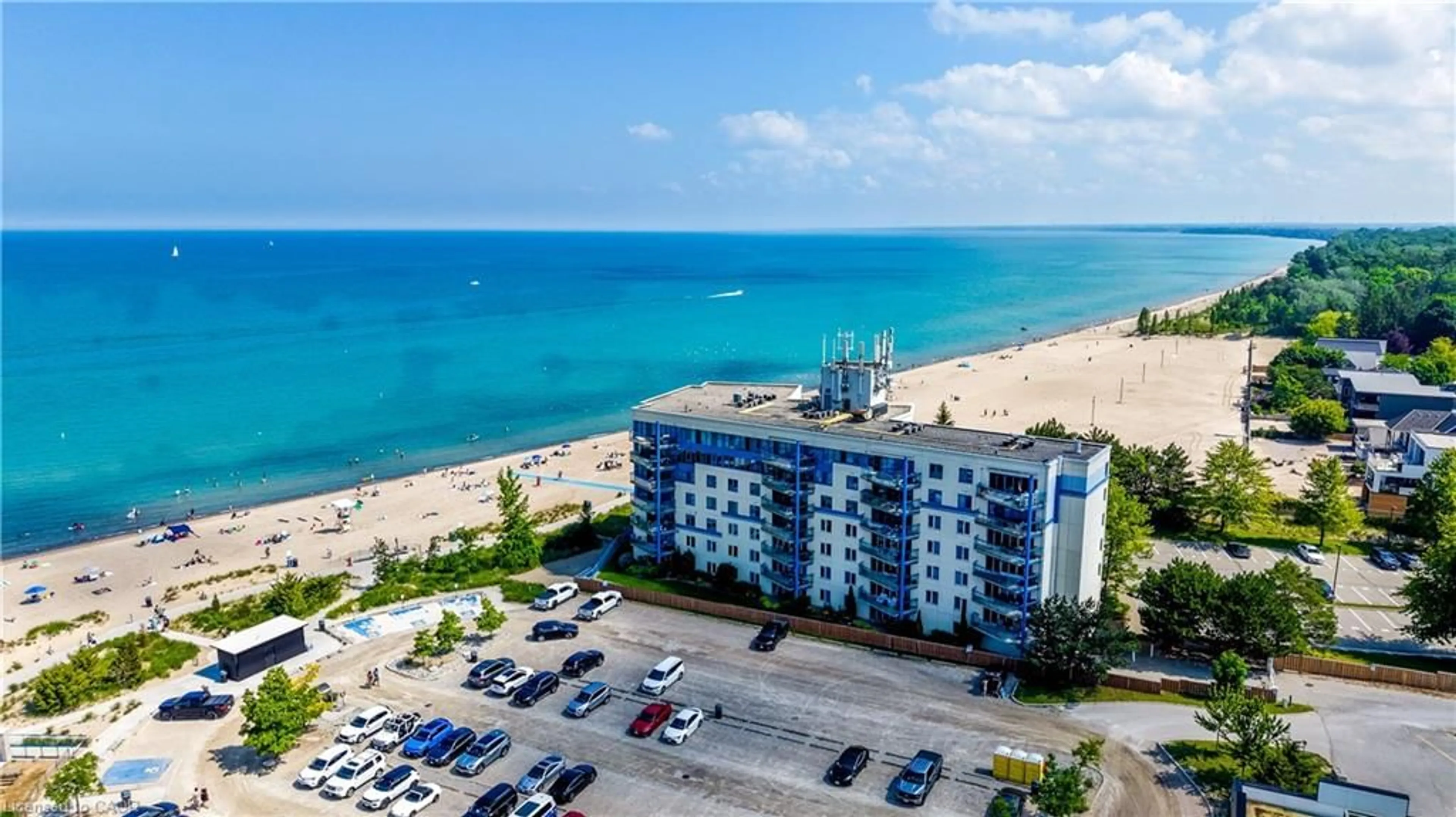 A pic from outside/outdoor area/front of a property/back of a property/a pic from drone, water/lake/river/ocean view for 9 Pine St #102, Grand Bend Ontario N0M 1T0