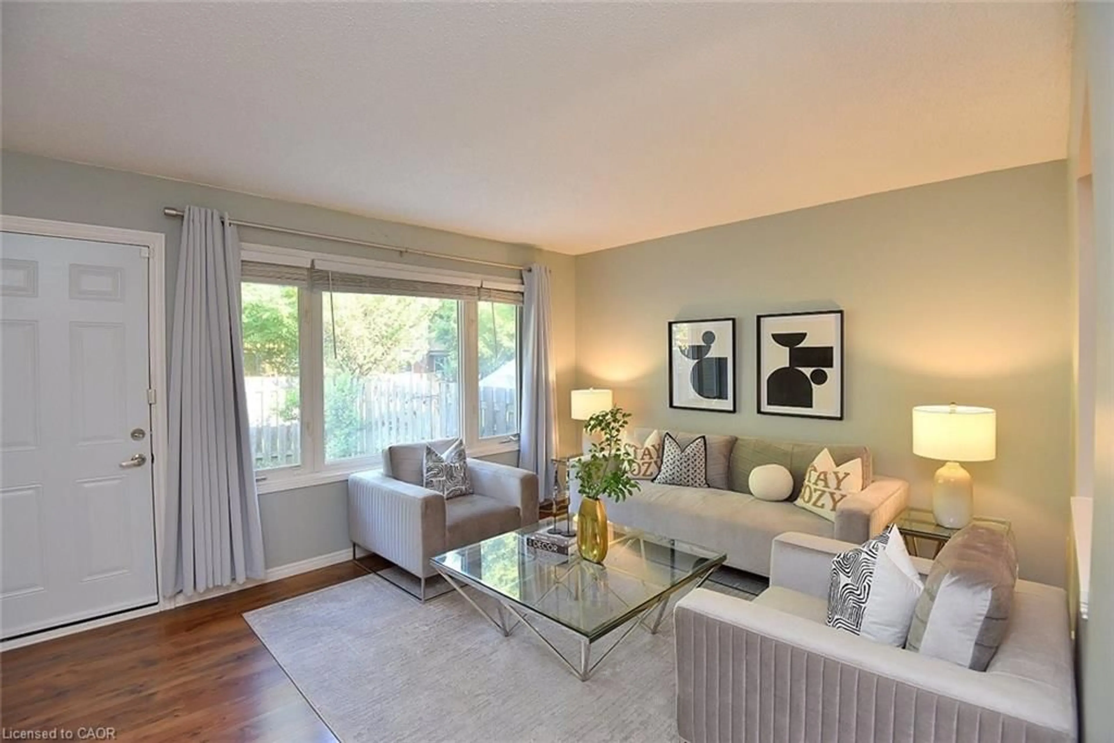 Living room with furniture, wood/laminate floor for 299 Limeridge Rd #4, Hamilton Ontario L9C 2V4