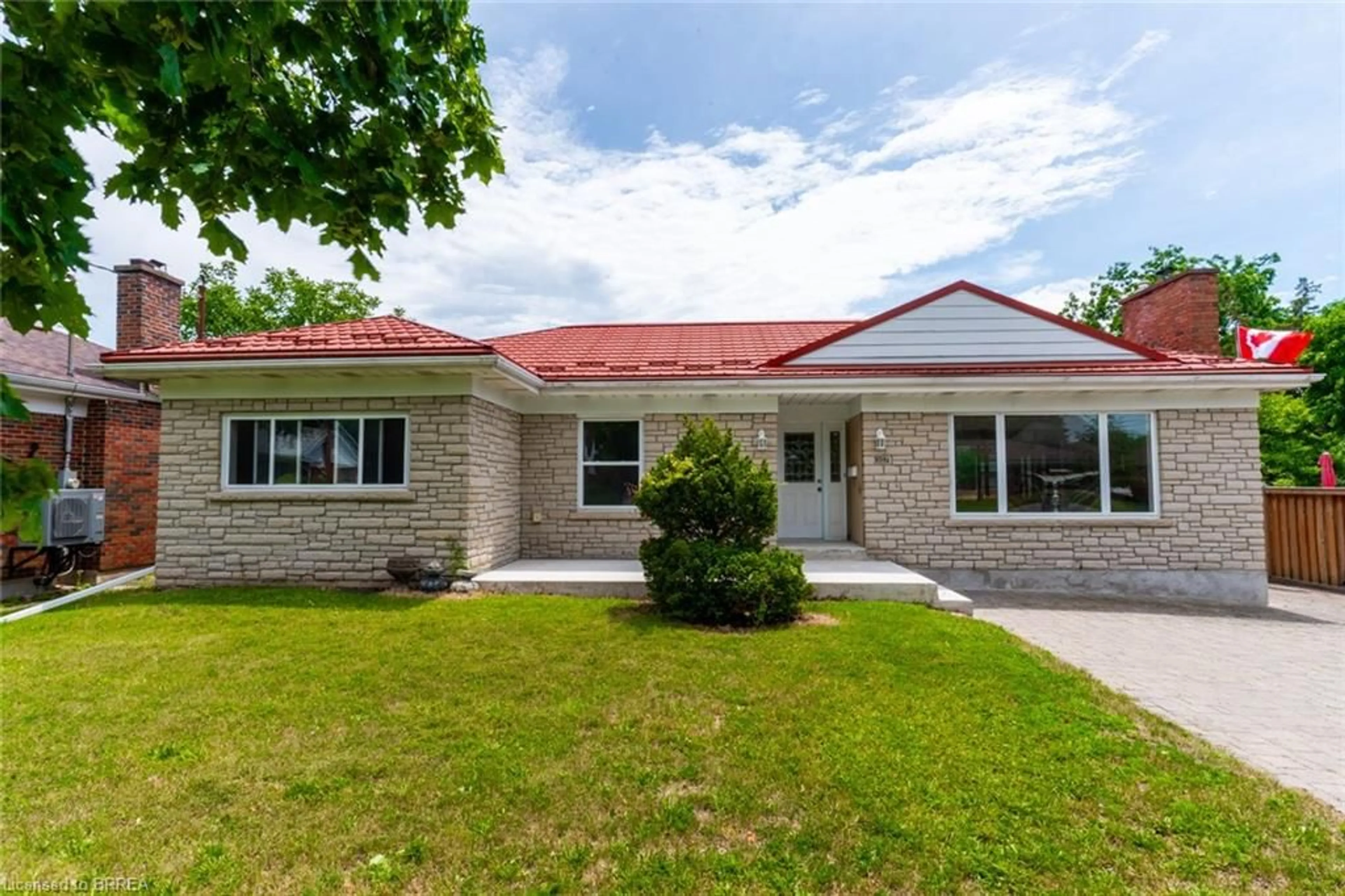 Home with brick exterior material, street for 107 Queensway Dr, Brantford Ontario N3R 4X1