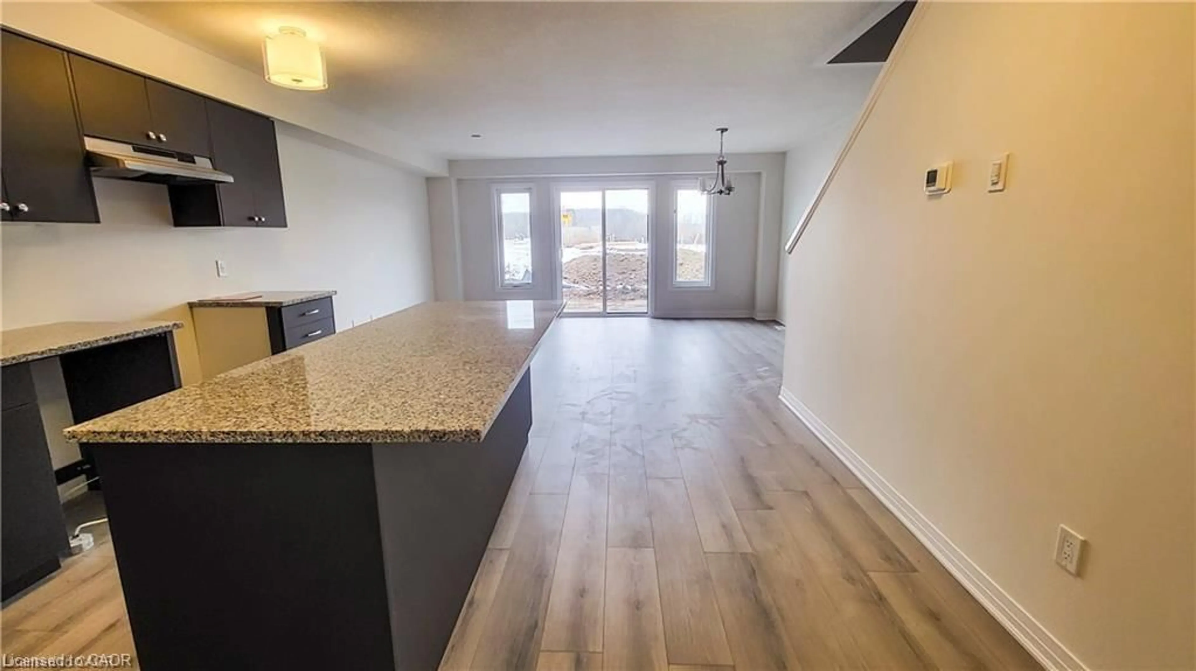 Open concept kitchen, wood/laminate floor for 19 Shaded Creek Dr, Kitchener Ontario N2P 0K7