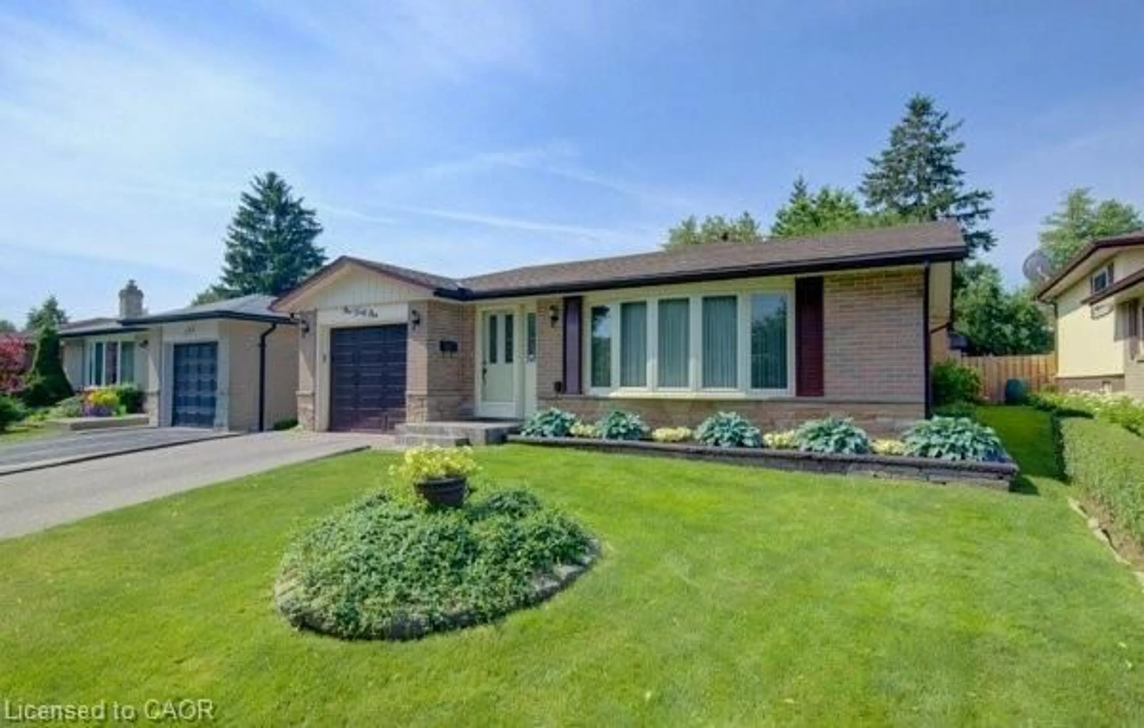 Home with brick exterior material, street for 141 Hazelglen Dr, Kitchener Ontario N2M 2E6