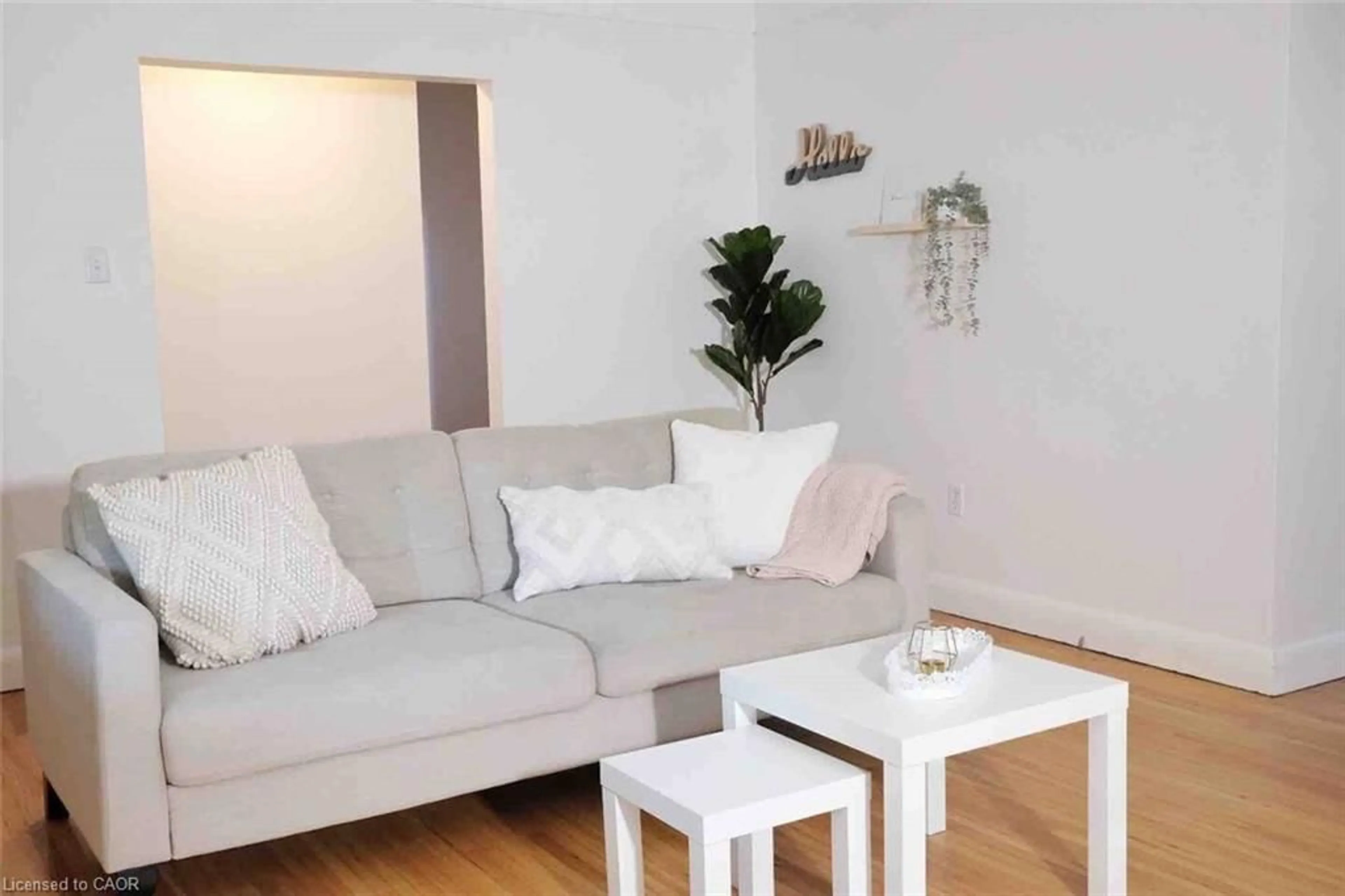 Living room with furniture, wood/laminate floor for 919 Montgomery Dr, Ancaster Ontario L9G 3H6