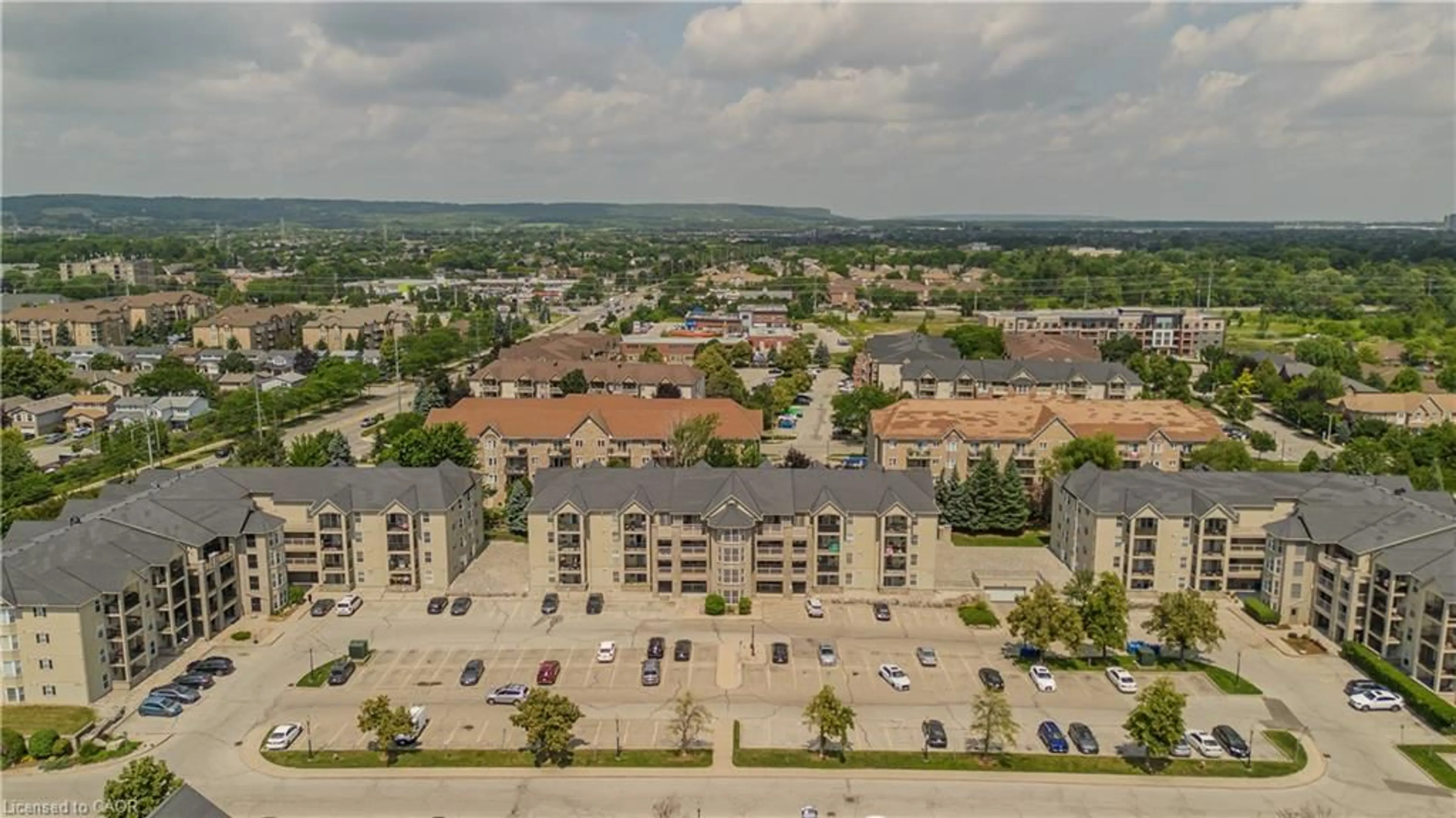 A pic from outside/outdoor area/front of a property/back of a property/a pic from drone, city buildings view from balcony for 1441 Walker's Line #306, Burlington Ontario L7M 4P2