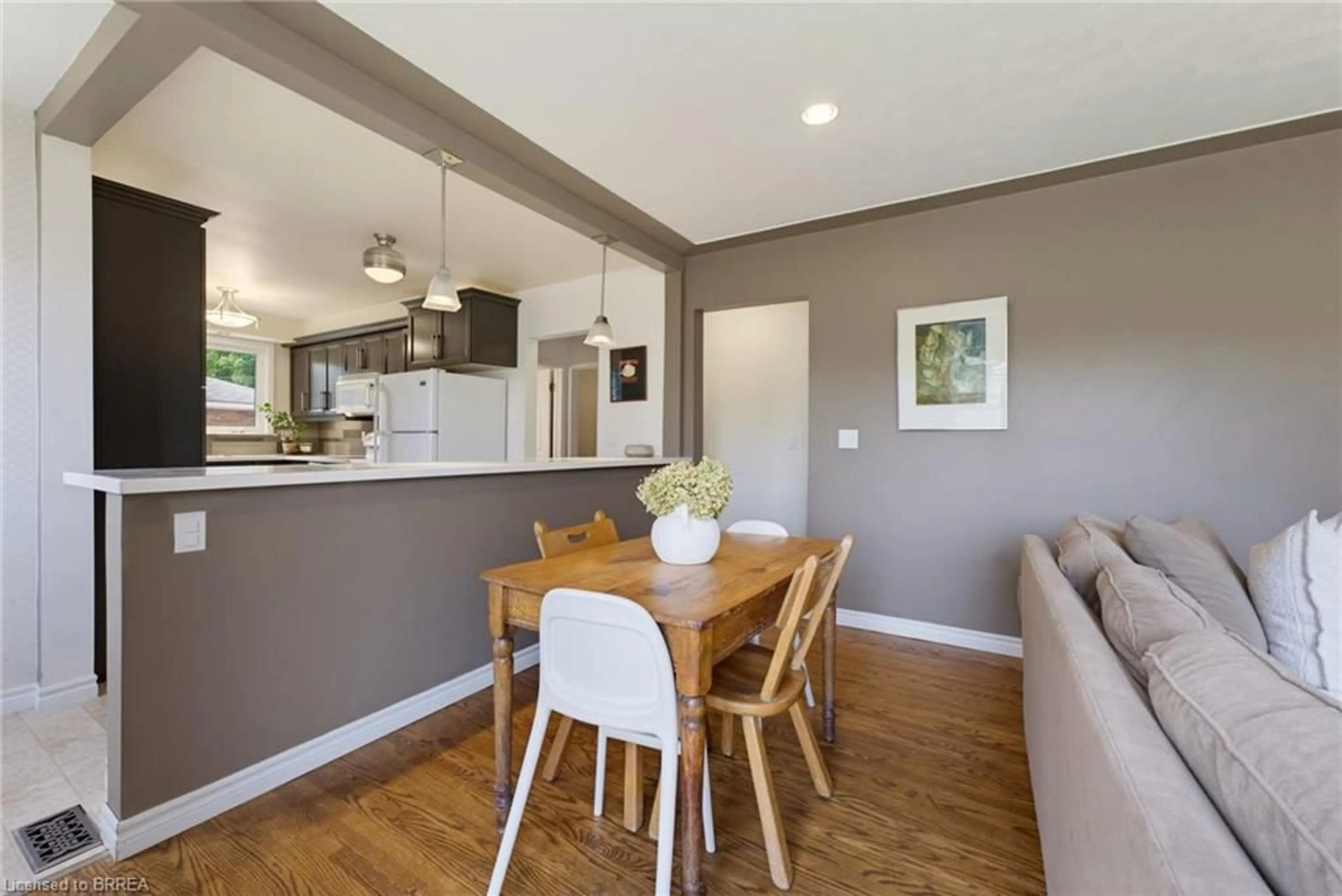 Open concept kitchen, wood/laminate floor for 87 Ball St, Paris Ontario N3L 1X7