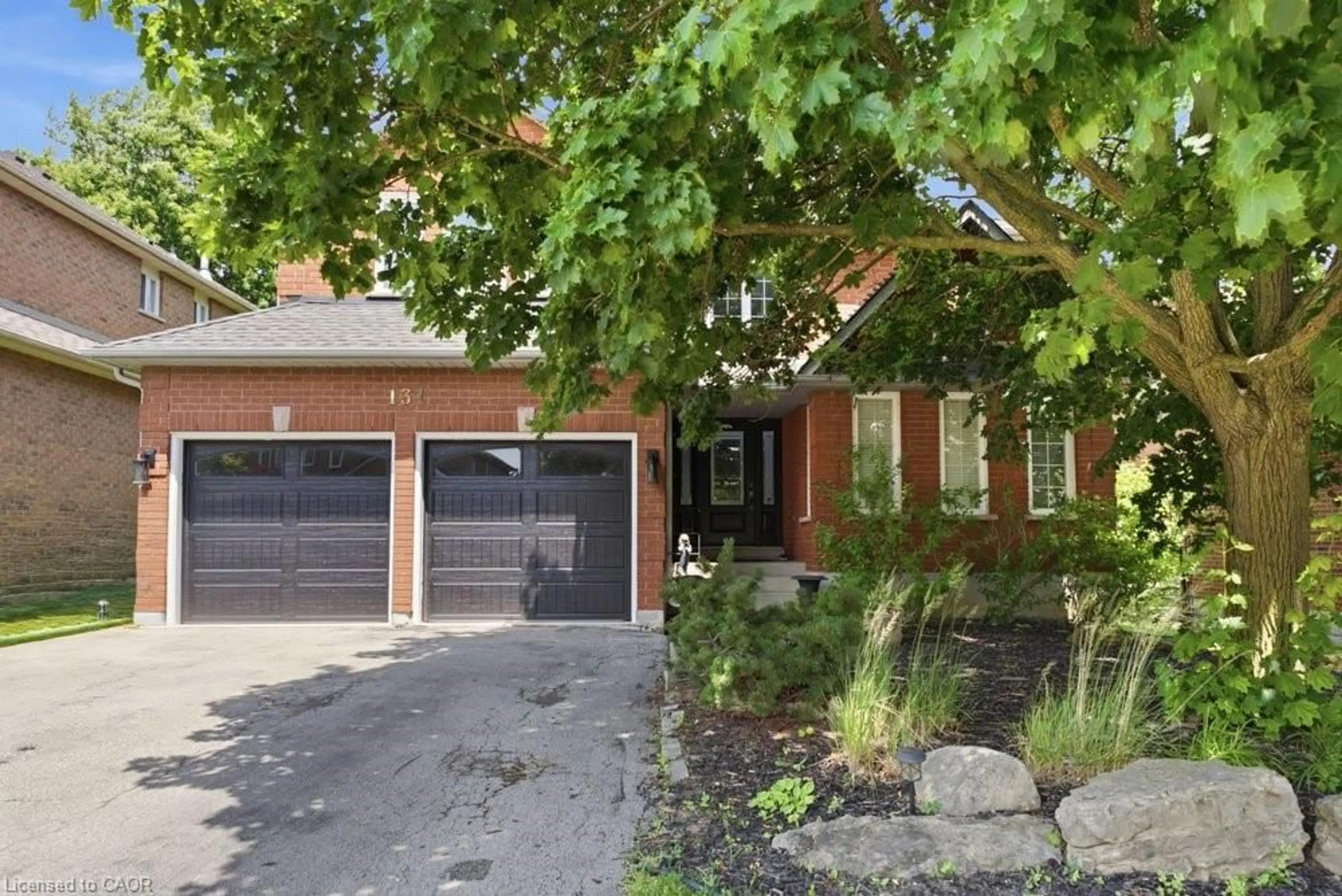 Home with brick exterior material, street for 131 Huntingwood Ave, Hamilton Ontario L9H 6X5