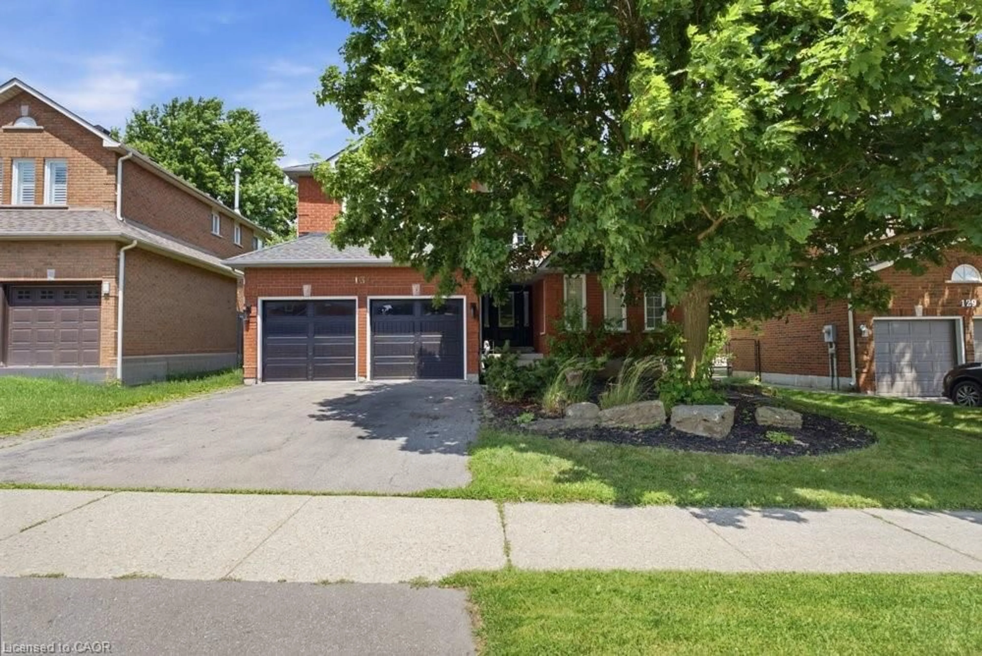Home with brick exterior material, street for 131 Huntingwood Ave, Hamilton Ontario L9H 6X5