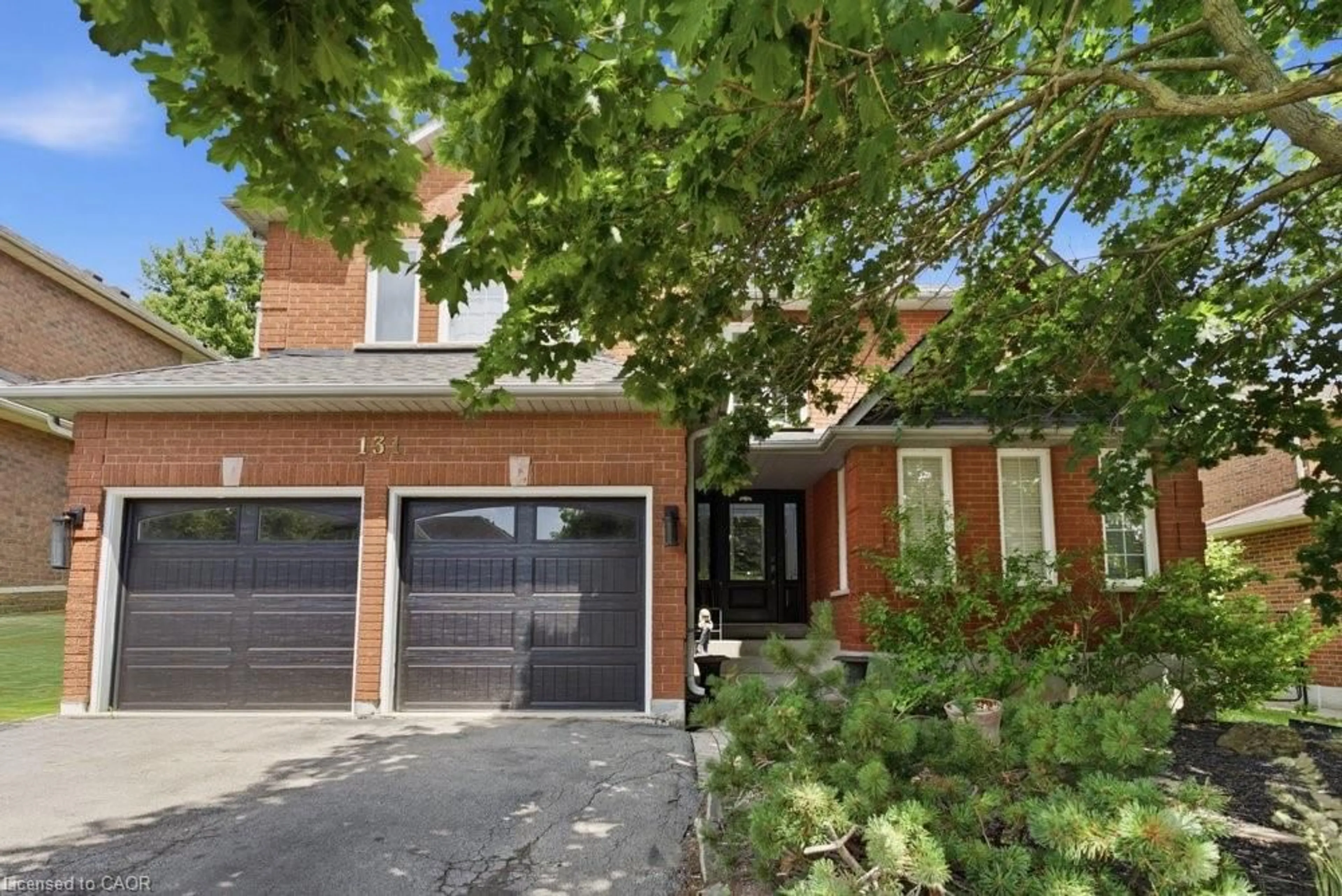 Home with brick exterior material, street for 131 Huntingwood Ave, Hamilton Ontario L9H 6X5