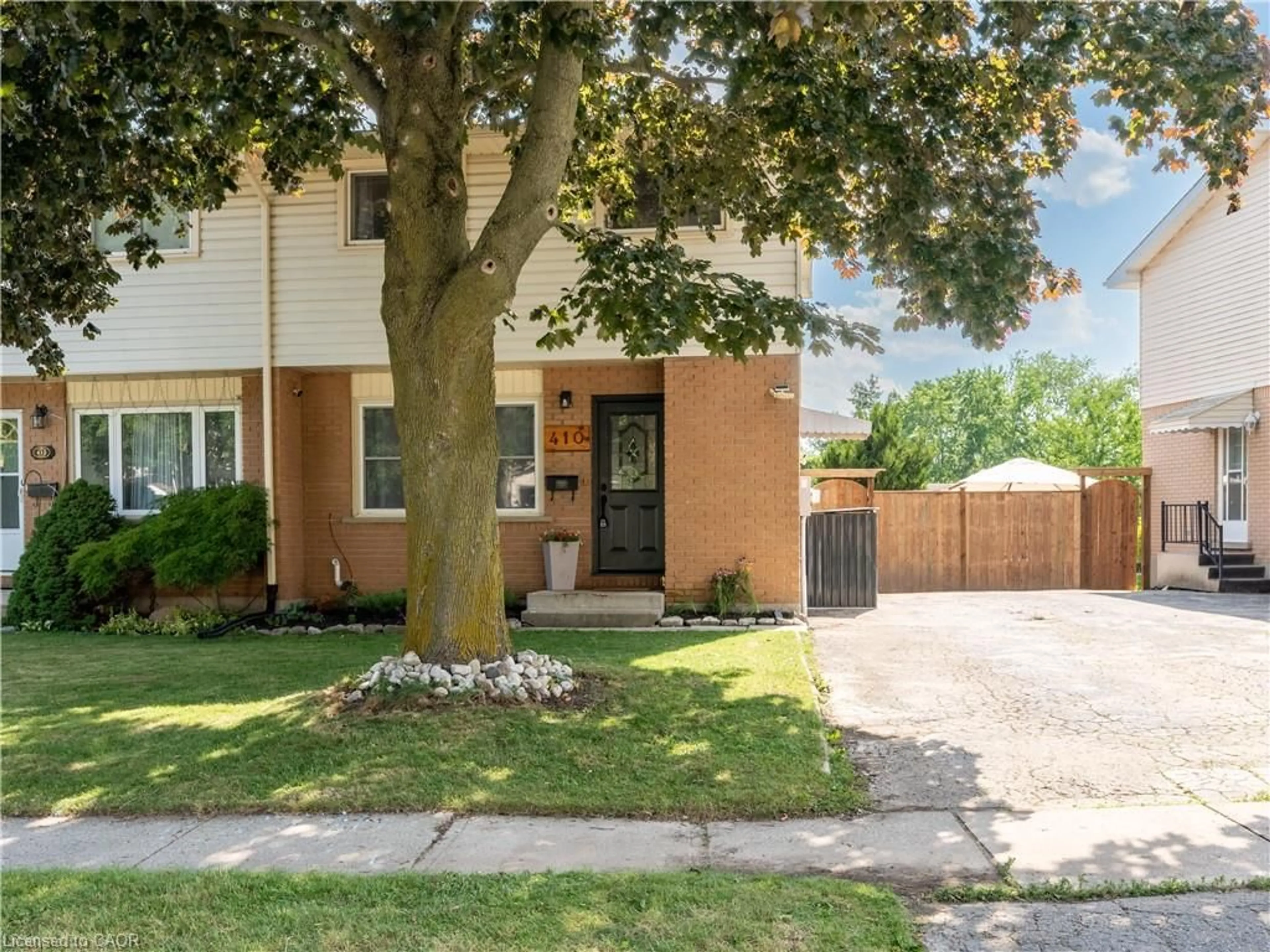 Home with brick exterior material, street for 410 Odlum Dr, Woodstock Ontario N4S 3S2