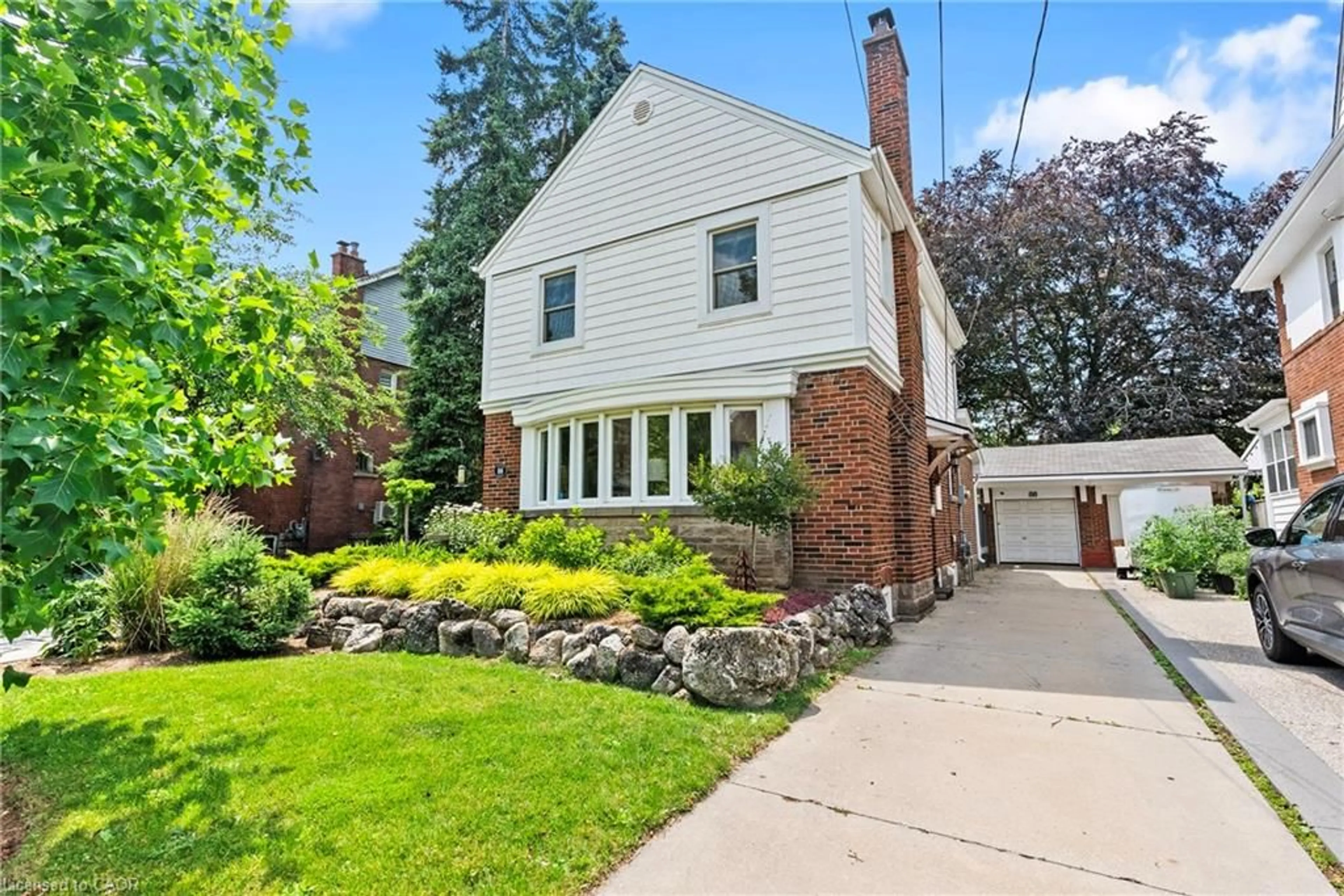Home with brick exterior material, street for 88 Rothsay Ave, Hamilton Ontario L8M 3G1