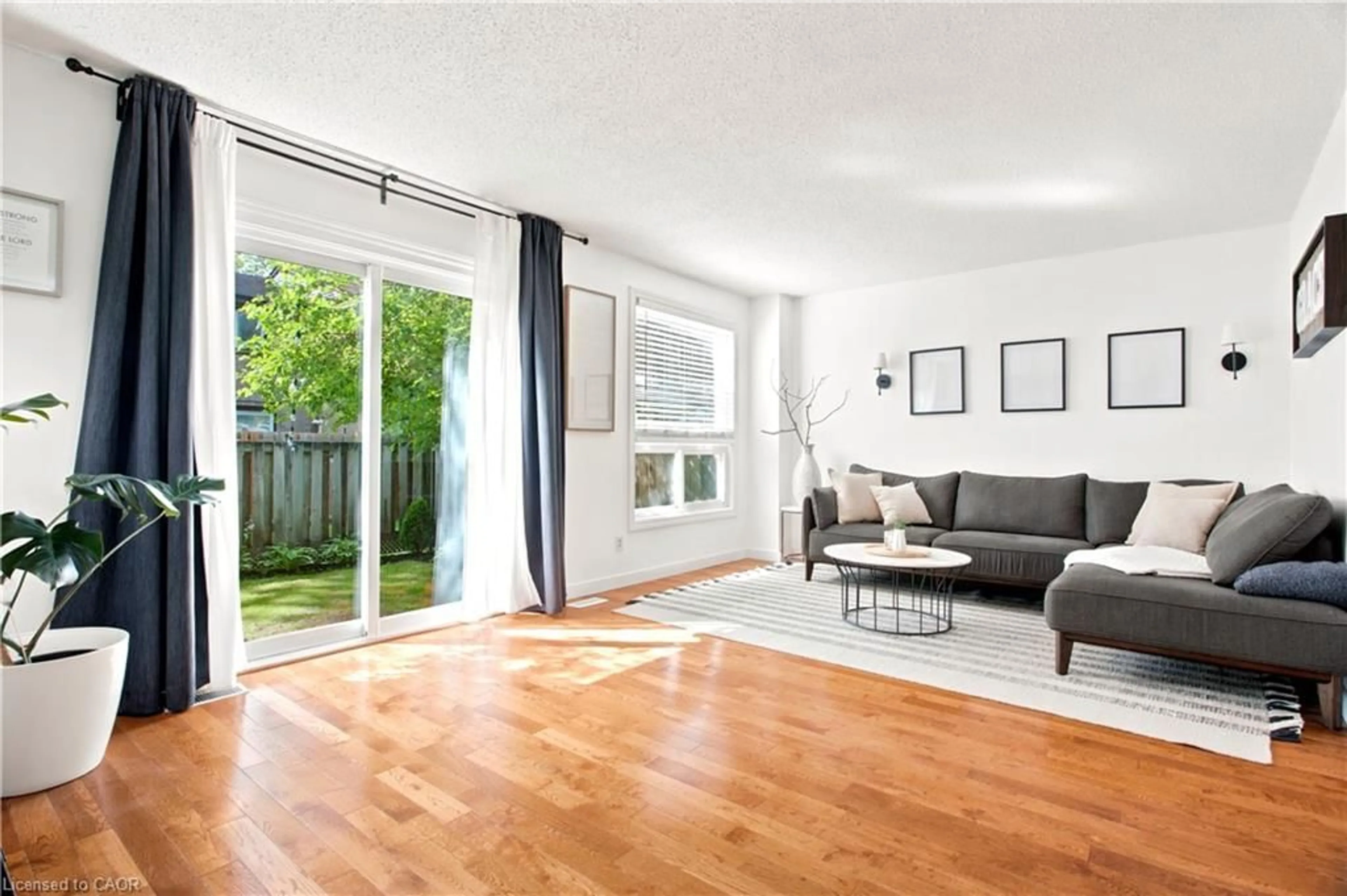 Living room with furniture, wood/laminate floor for 175 Siebert Ave #9, Kitchener Ontario N2C 2M1