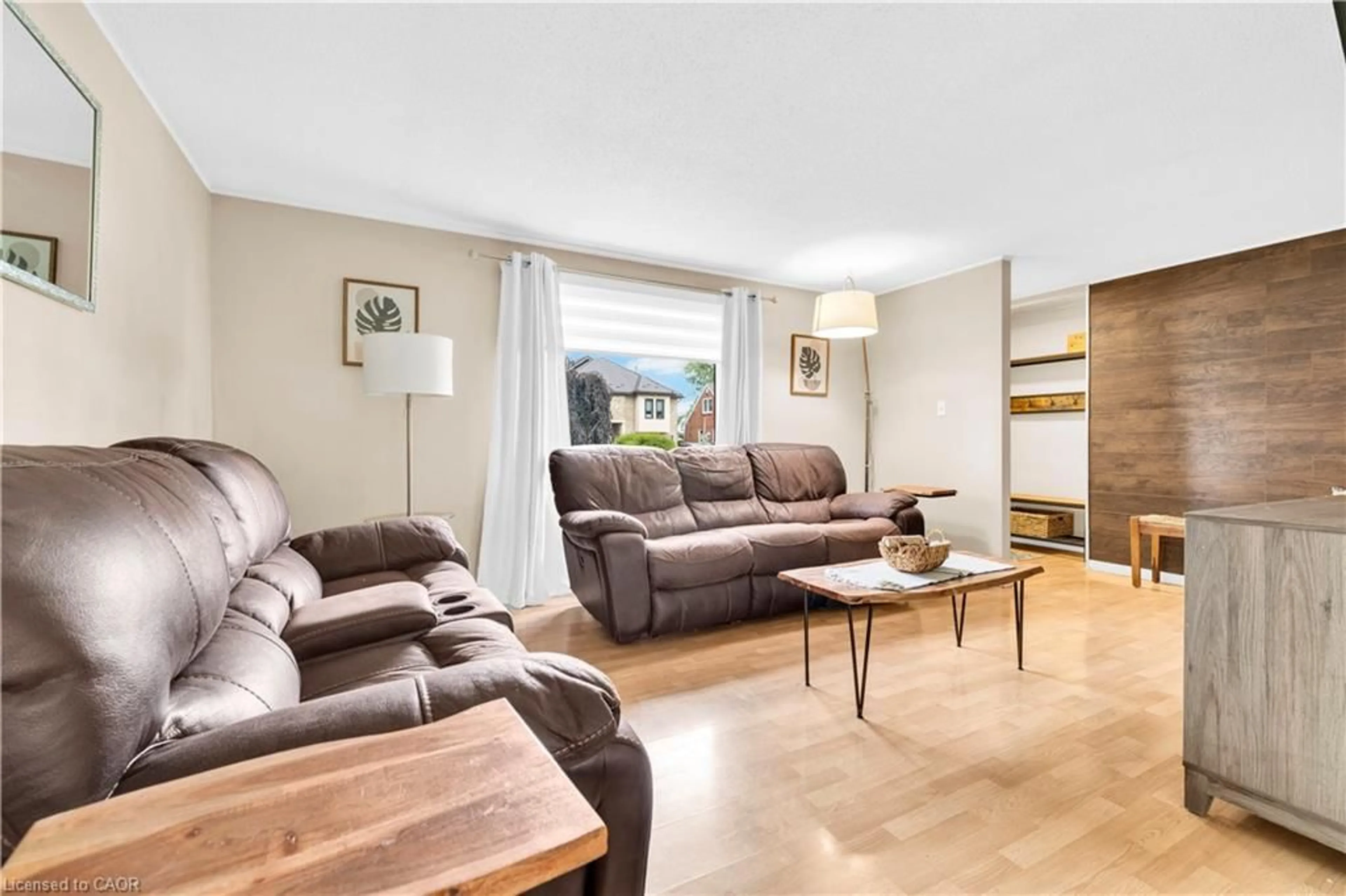 Living room with furniture, wood/laminate floor for 1045 Reedmere Rd, Windsor Ontario N8S 2L9