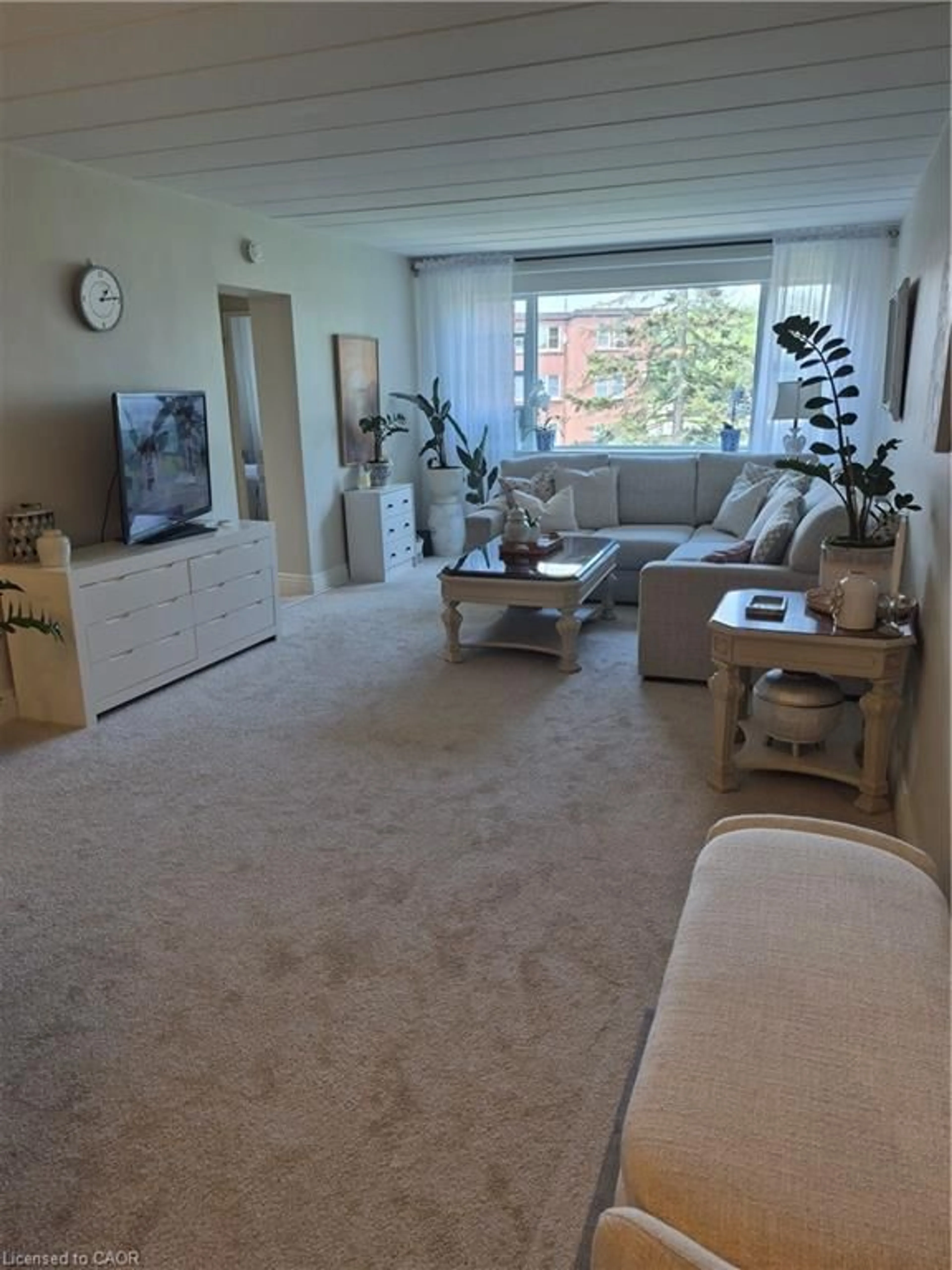 Living room with furniture, floor is not visible for 2422 New St #9, Burlington Ontario L7R 1J6