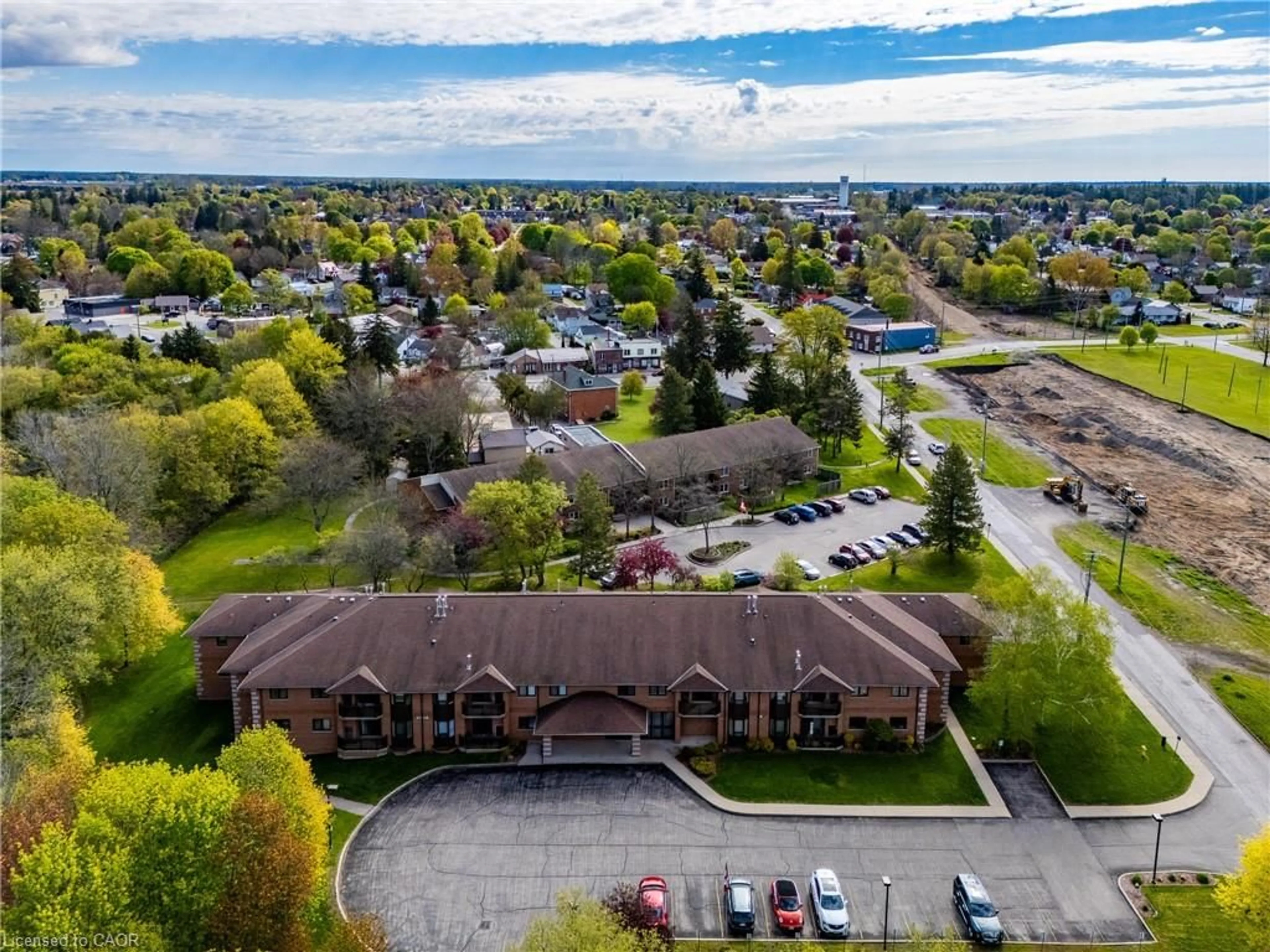 A pic from outside/outdoor area/front of a property/back of a property/a pic from drone, unknown for 303 William St #103, Delhi Ontario N4B 1N1