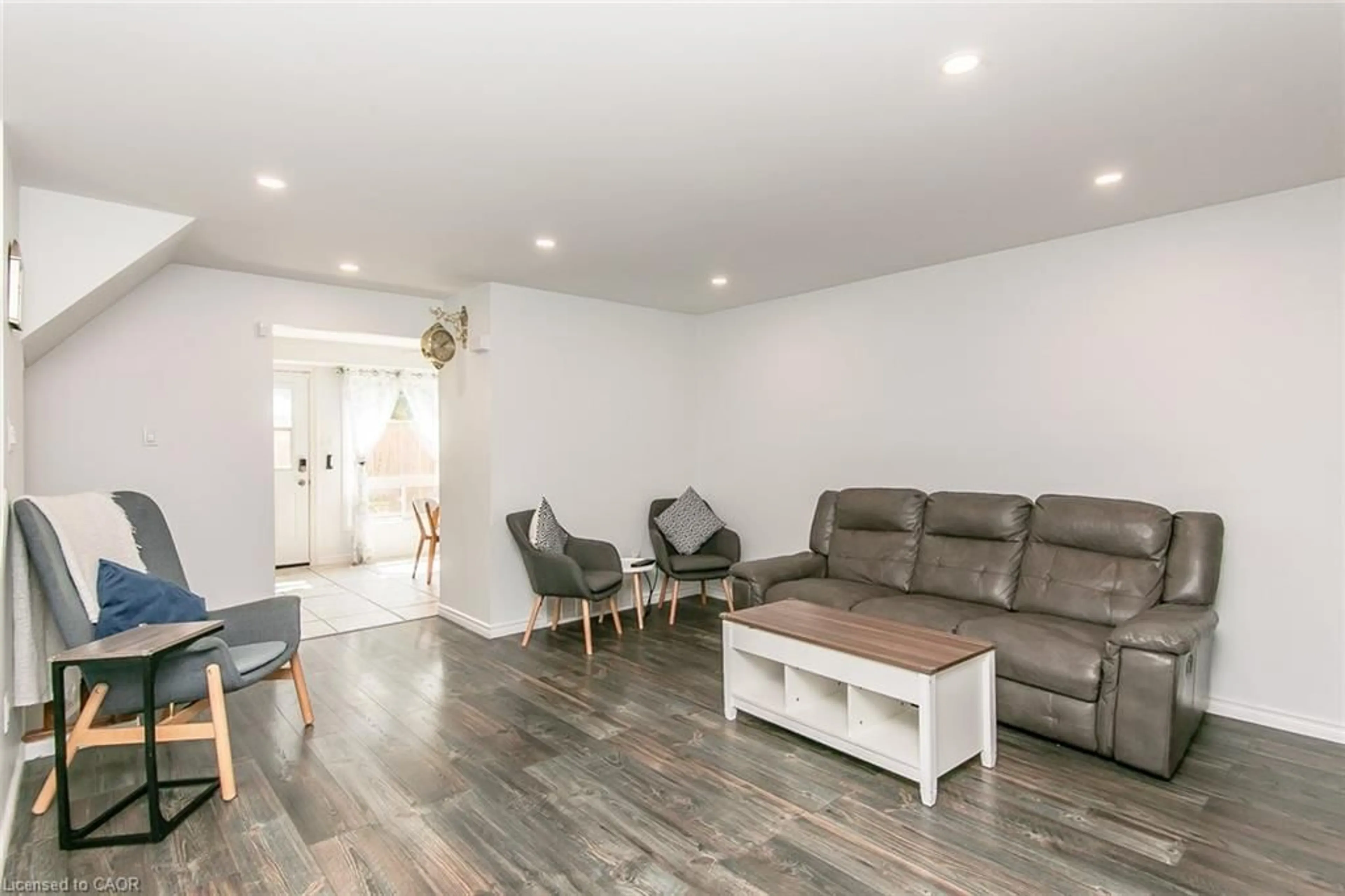 Living room with furniture, wood/laminate floor for 223 Pioneer Dr #J62, Kitchener Ontario N2P 1L9