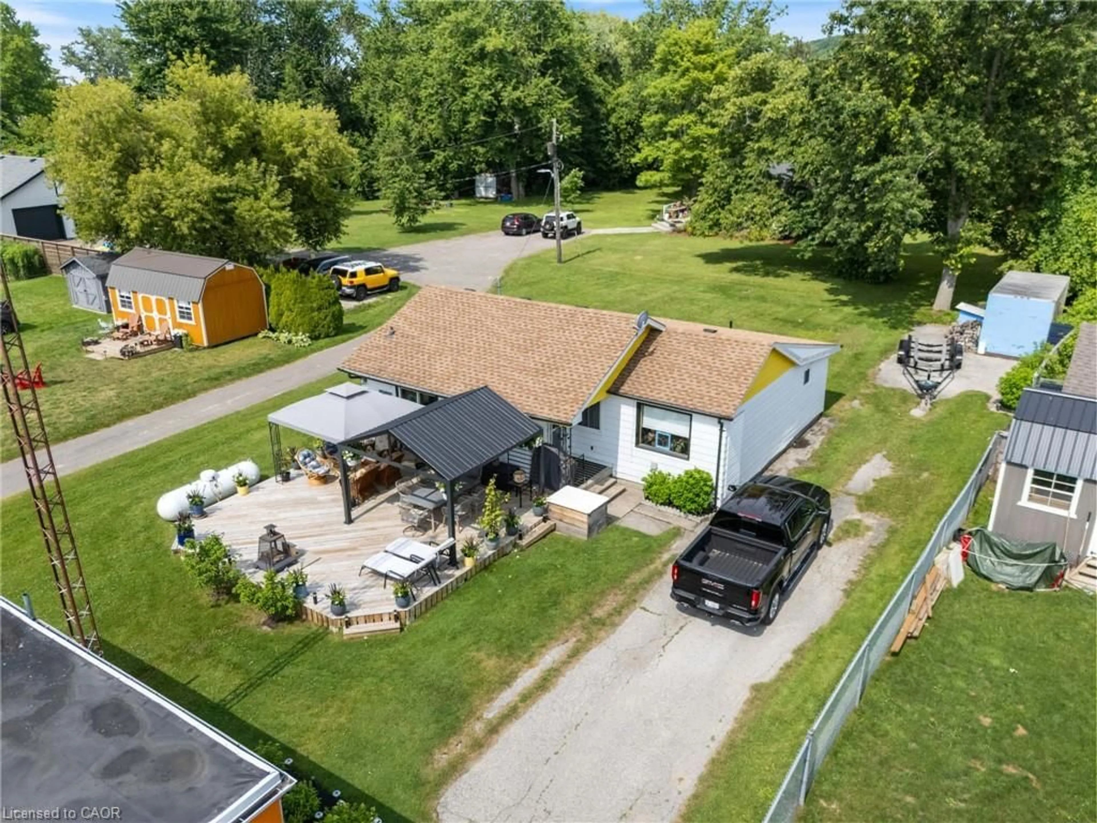 A pic from outside/outdoor area/front of a property/back of a property/a pic from drone, street for 103 Cedar Dr, Turkey Point Ontario N0E 1T0