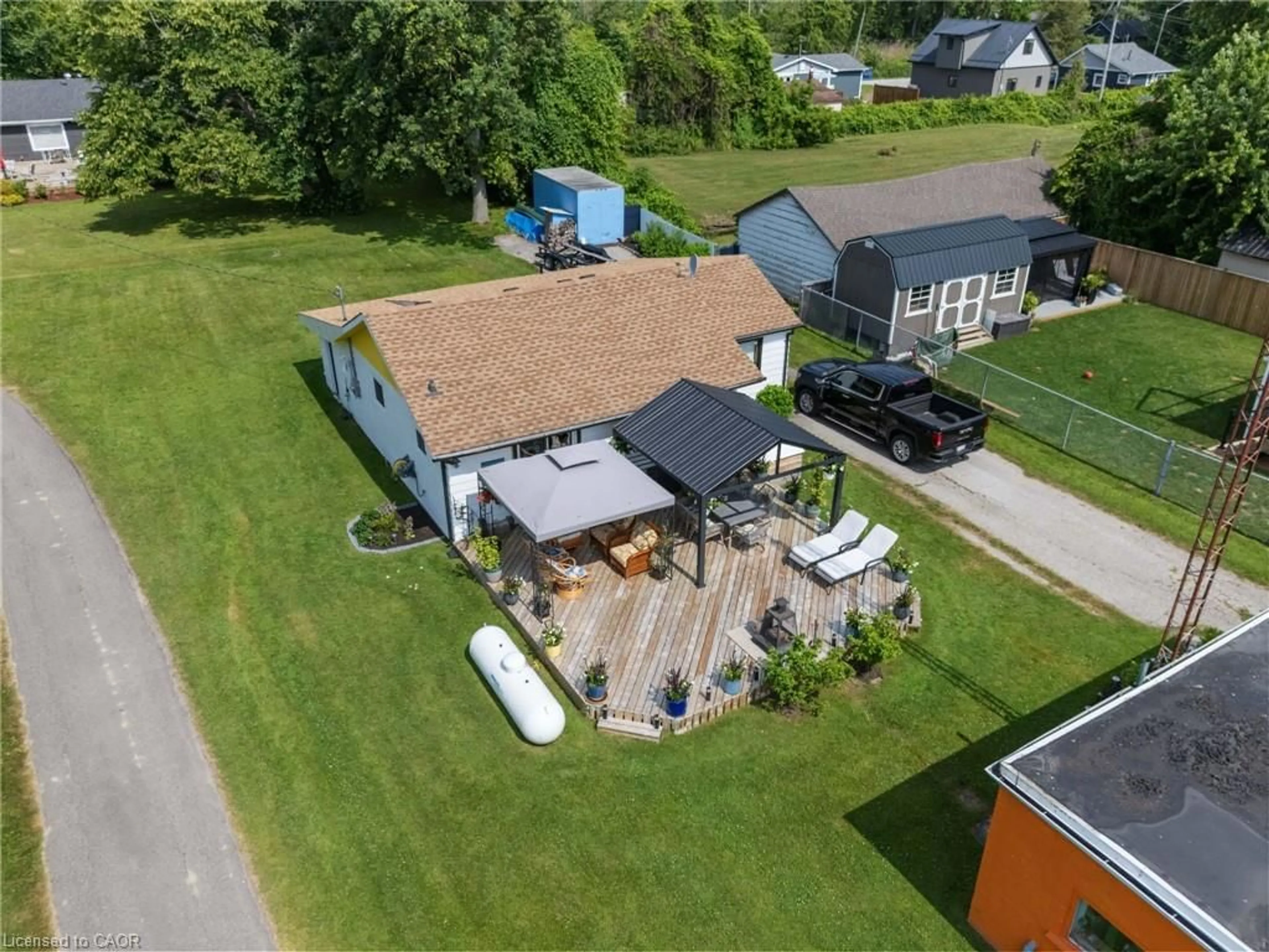 A pic from outside/outdoor area/front of a property/back of a property/a pic from drone, street for 103 Cedar Dr, Turkey Point Ontario N0E 1T0
