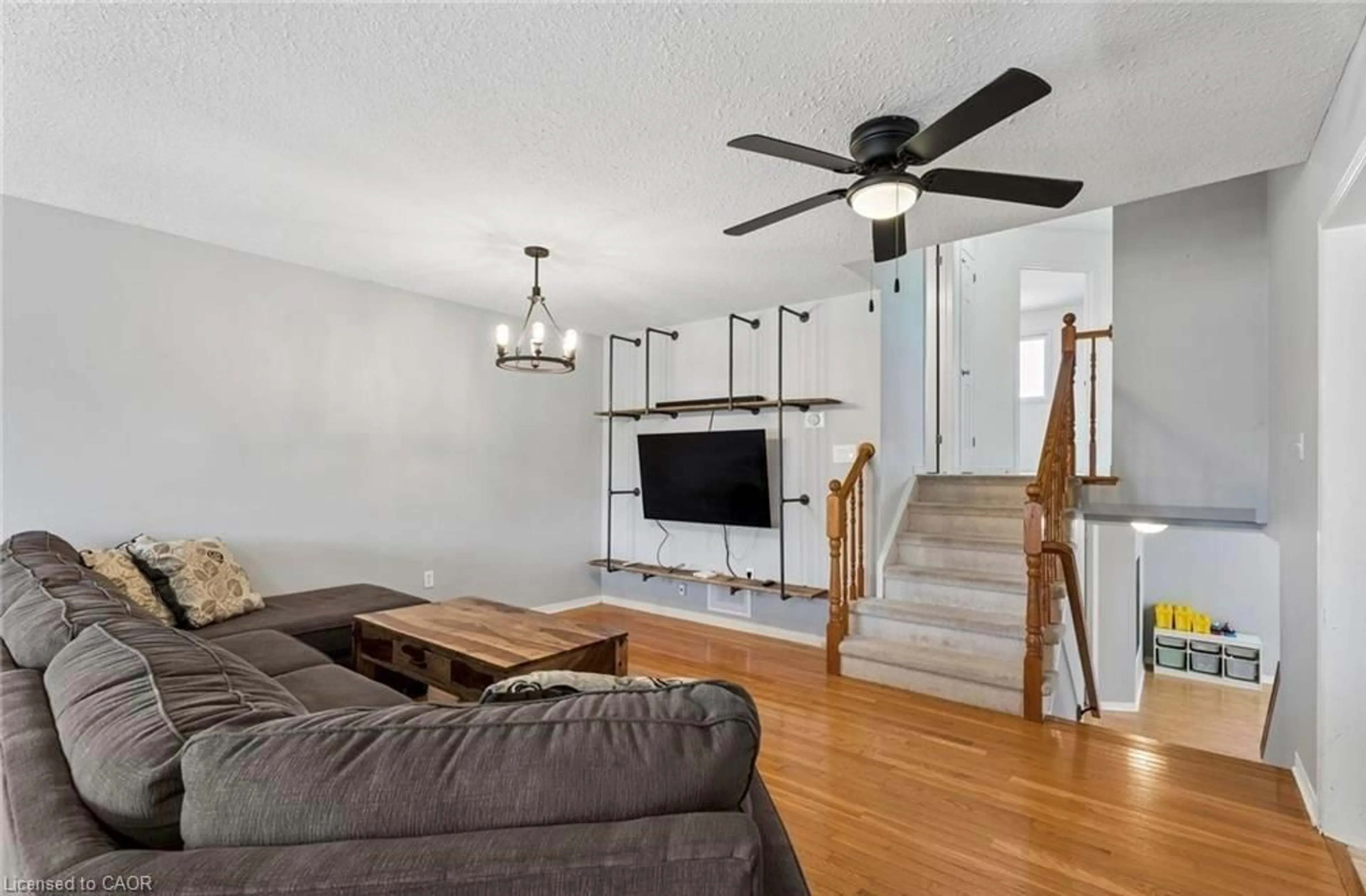 Living room with furniture, wood/laminate floor for 56 Golden Acres Dr, Smithville Ontario L0R 2A0