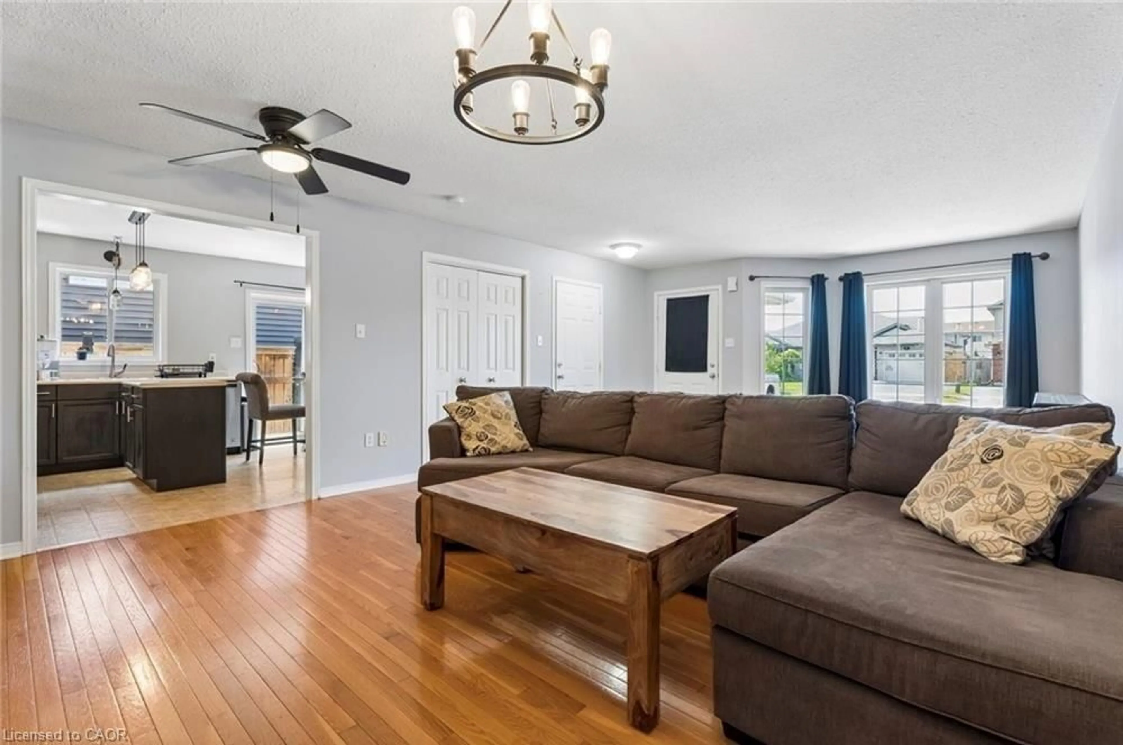 Living room with furniture, wood/laminate floor for 56 Golden Acres Dr, Smithville Ontario L0R 2A0