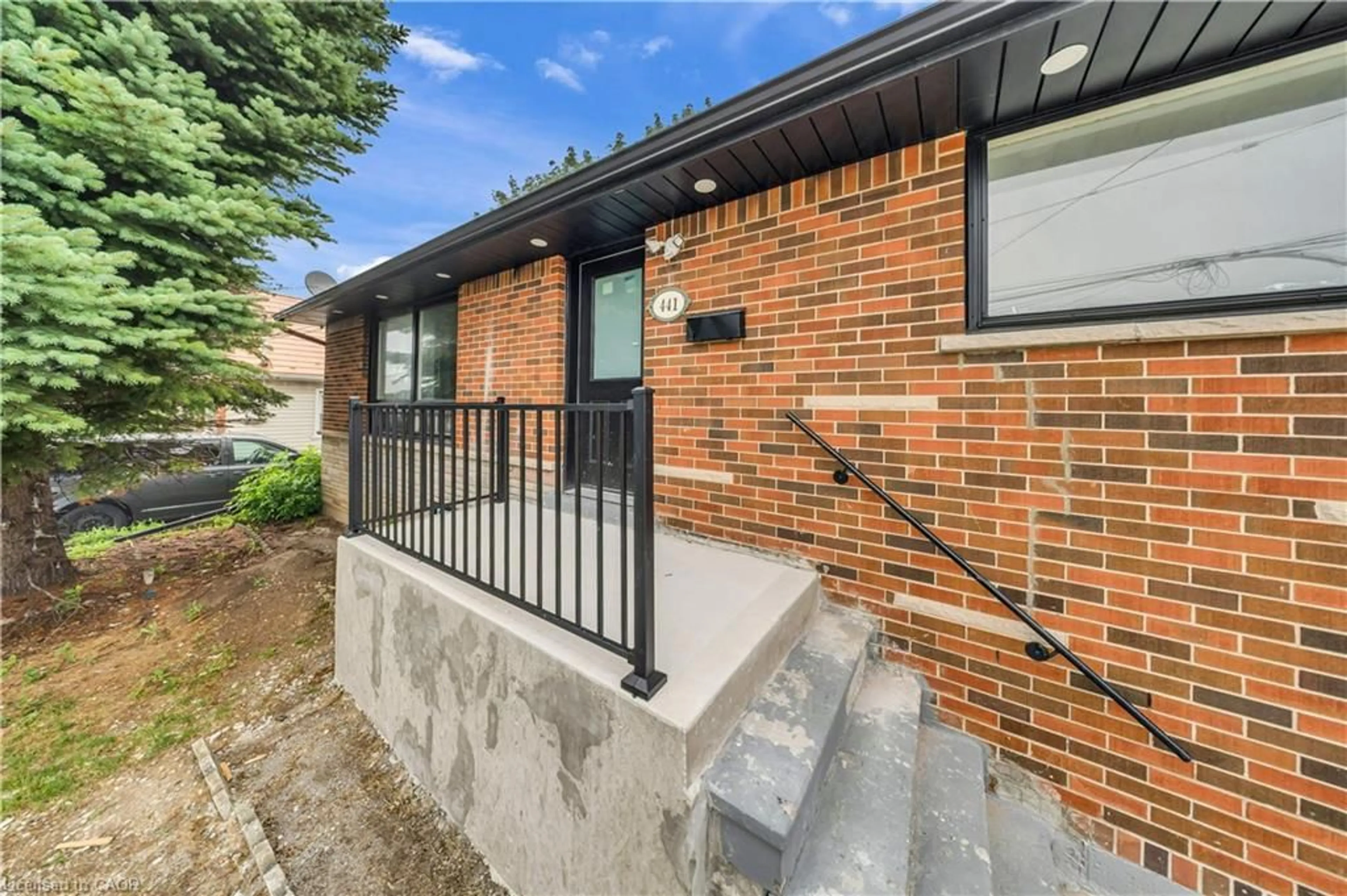 Home with brick exterior material, street for 441 West 5th St, Hamilton Ontario L9C 3P5