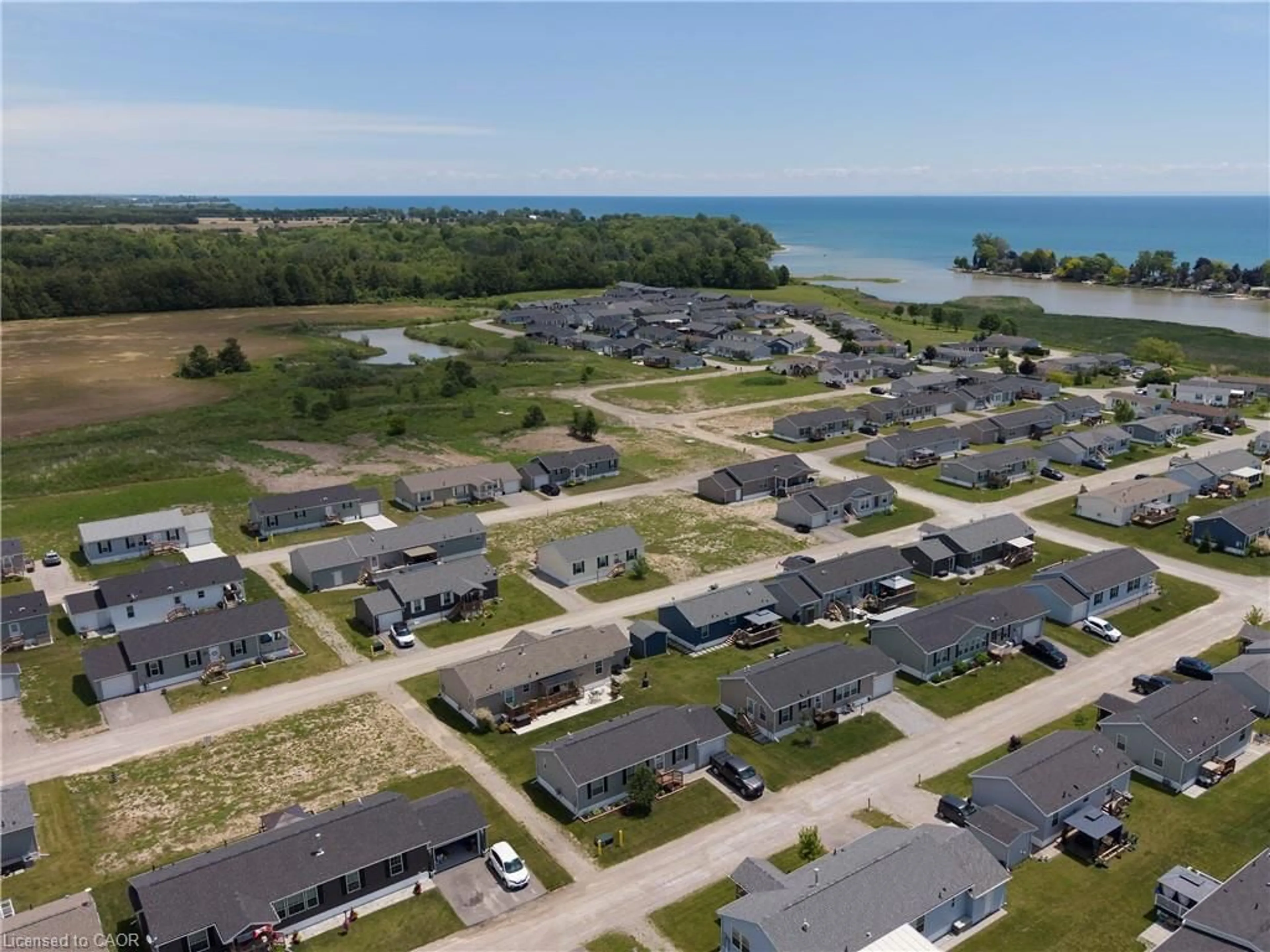 A pic from outside/outdoor area/front of a property/back of a property/a pic from drone, water/lake/river/ocean view for 10 Bent Willow Crt, Haldimand County Ontario N0A 1L0