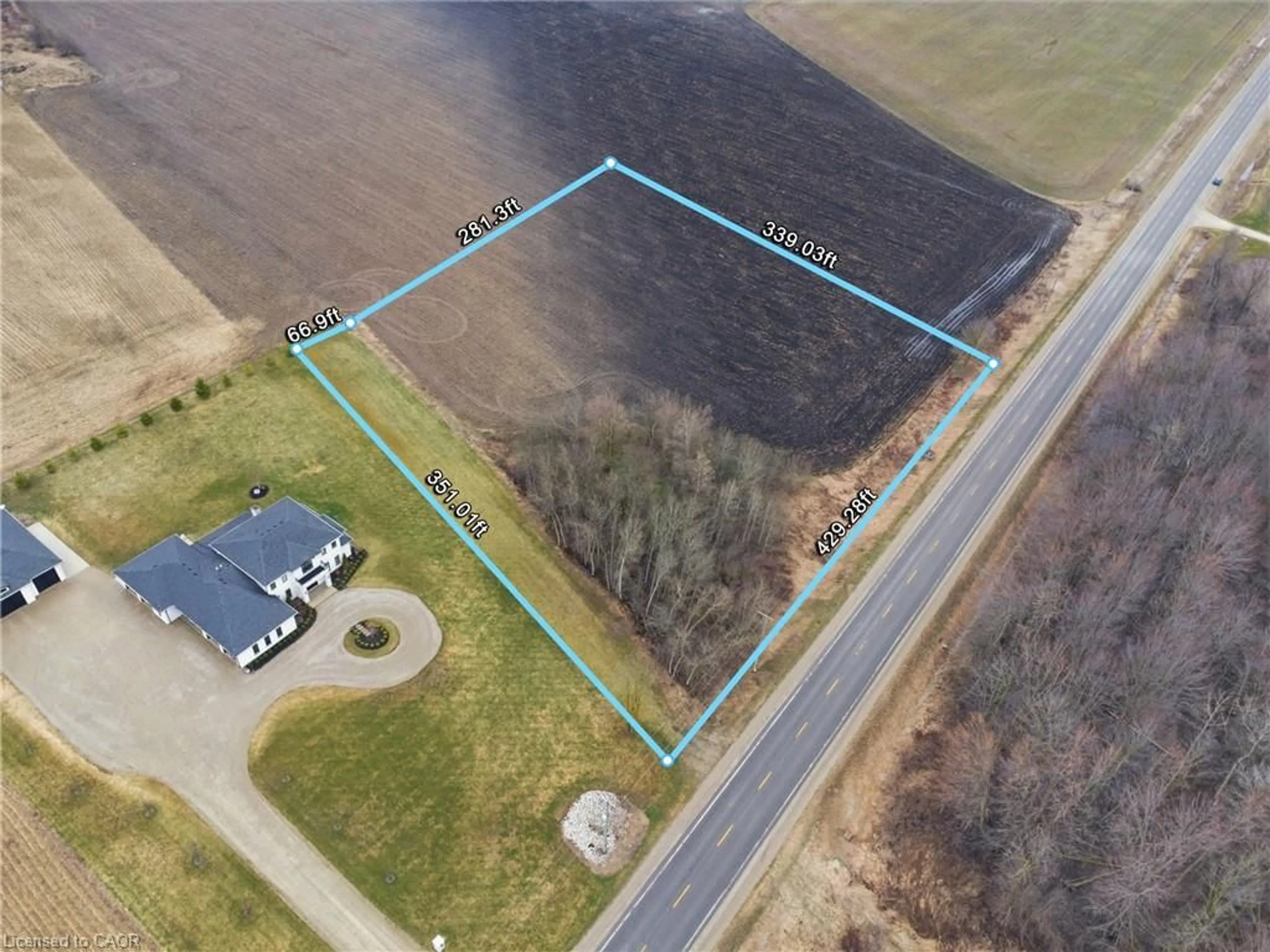 A pic from outside/outdoor area/front of a property/back of a property/a pic from drone, building for 9 Wellington Road 9, Mapleton Ontario N0G 2T0