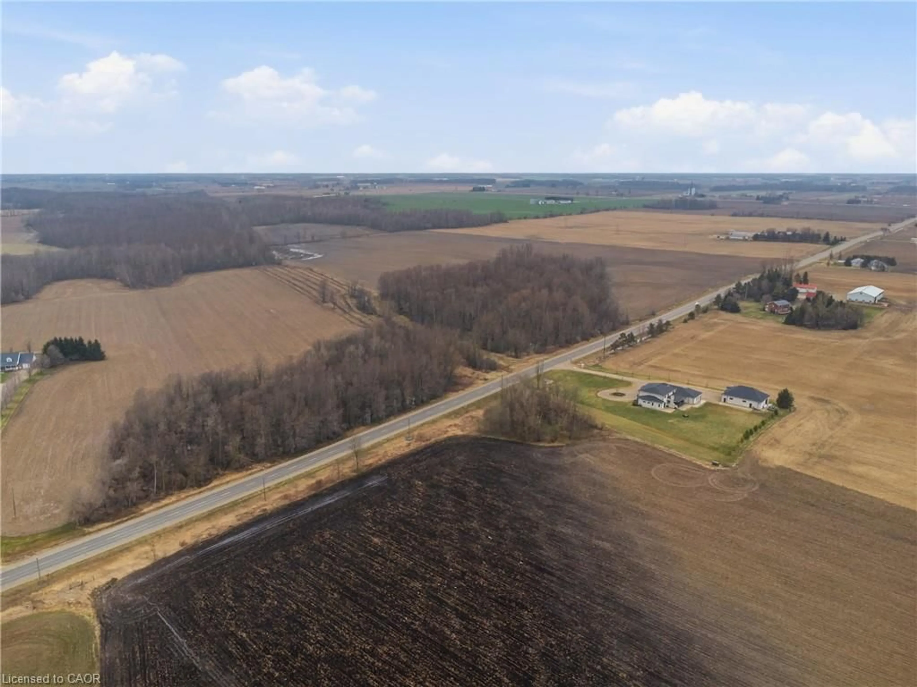 A pic from outside/outdoor area/front of a property/back of a property/a pic from drone, unknown for 9 Wellington Road 9, Mapleton Ontario N0G 2T0