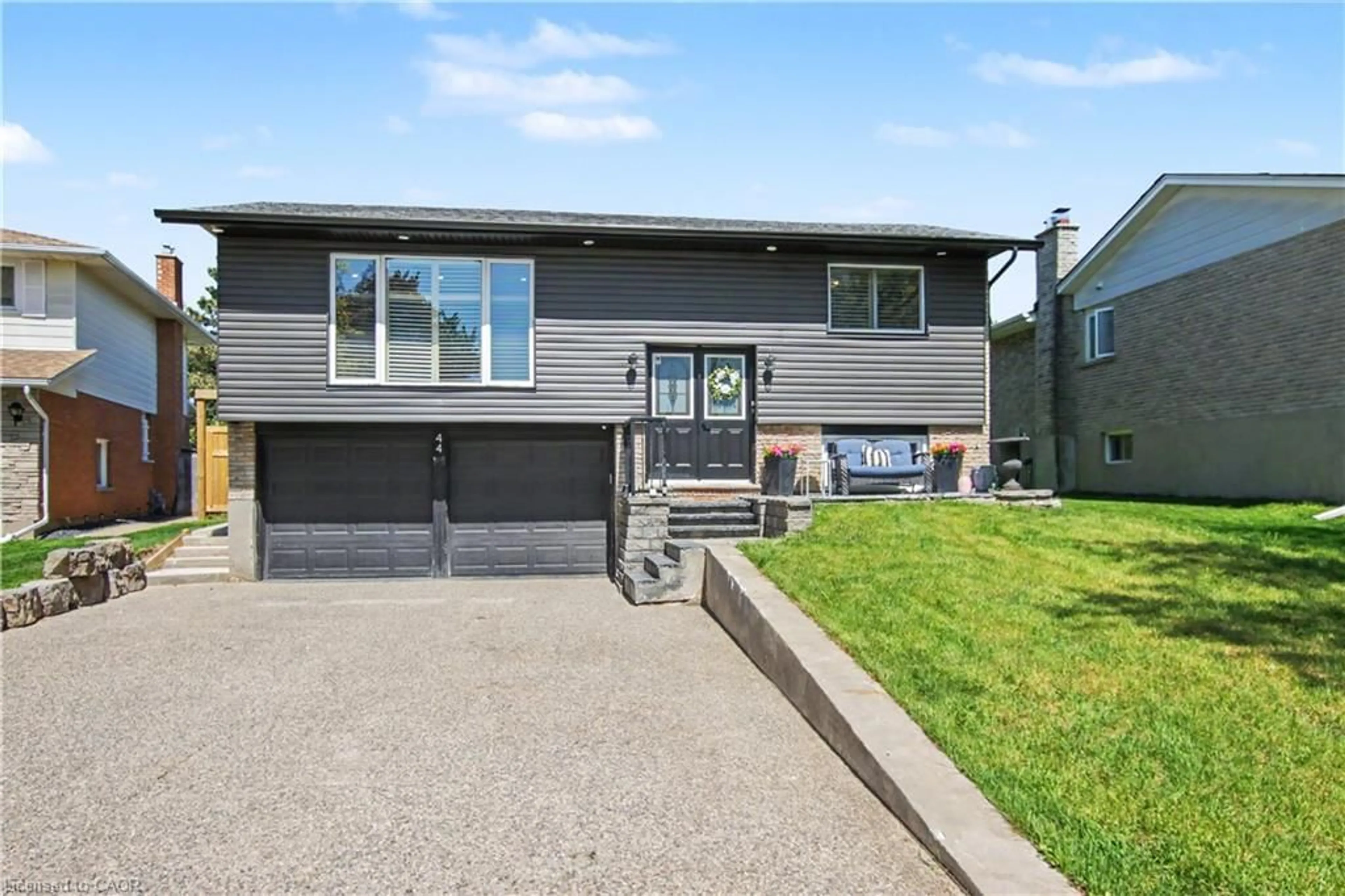 Home with vinyl exterior material, street for 44 Oakhurst Cres, Kitchener Ontario N2B 3K3