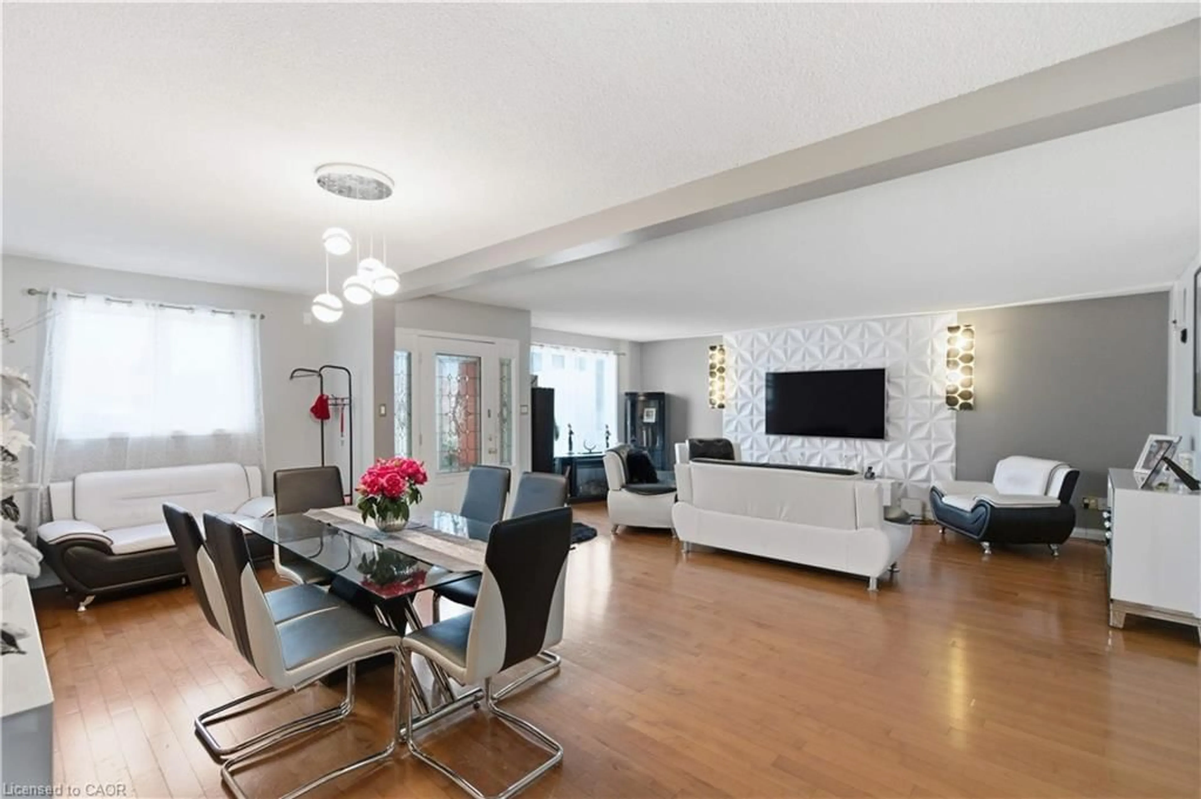 Living room with furniture, wood/laminate floor for 916 Stone Church Rd, Hamilton Ontario L8W 1B1