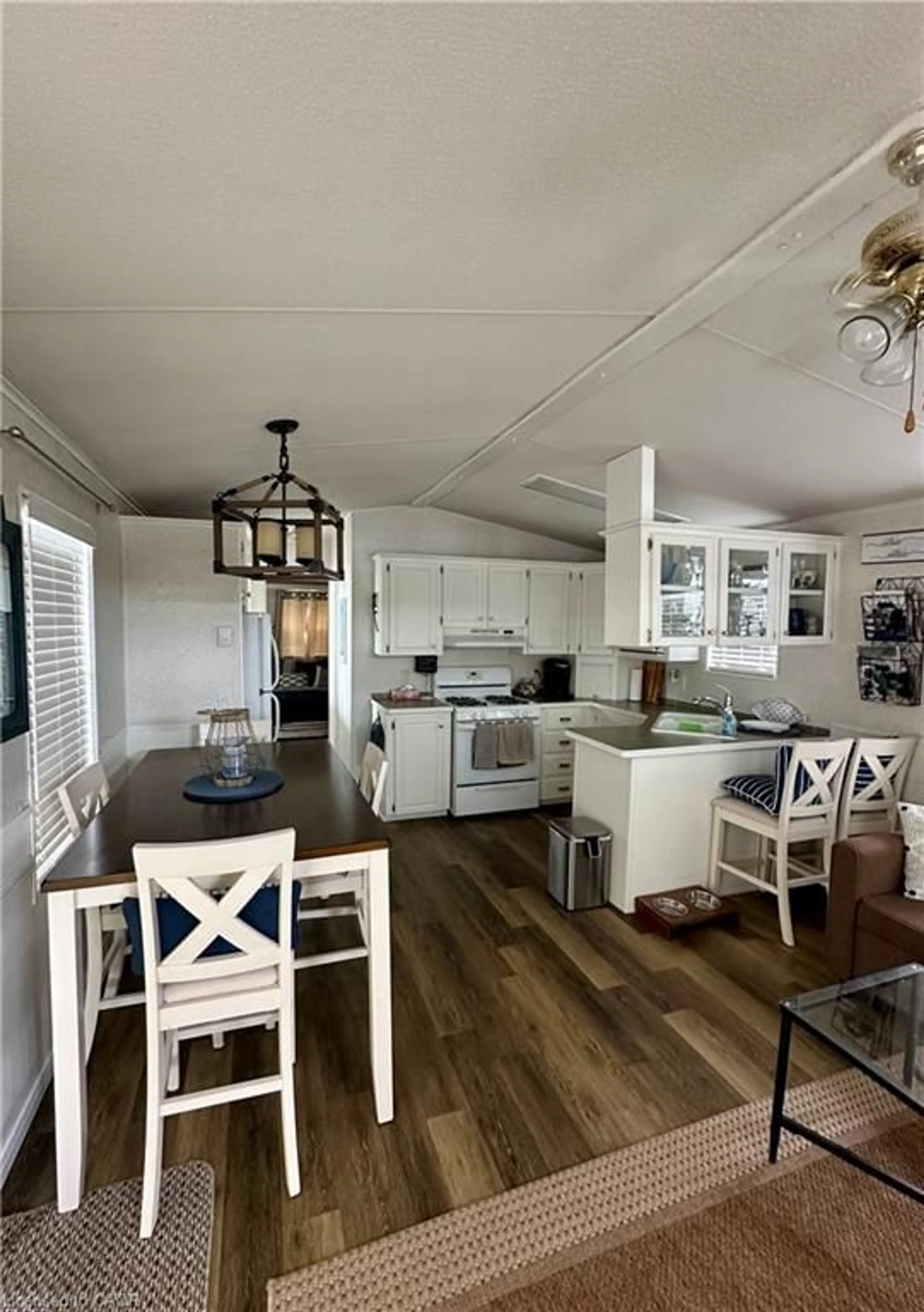Open concept kitchen, wood/laminate floor for 70 Bluewater Ave #91, St. Williams Ontario N0E 1P0