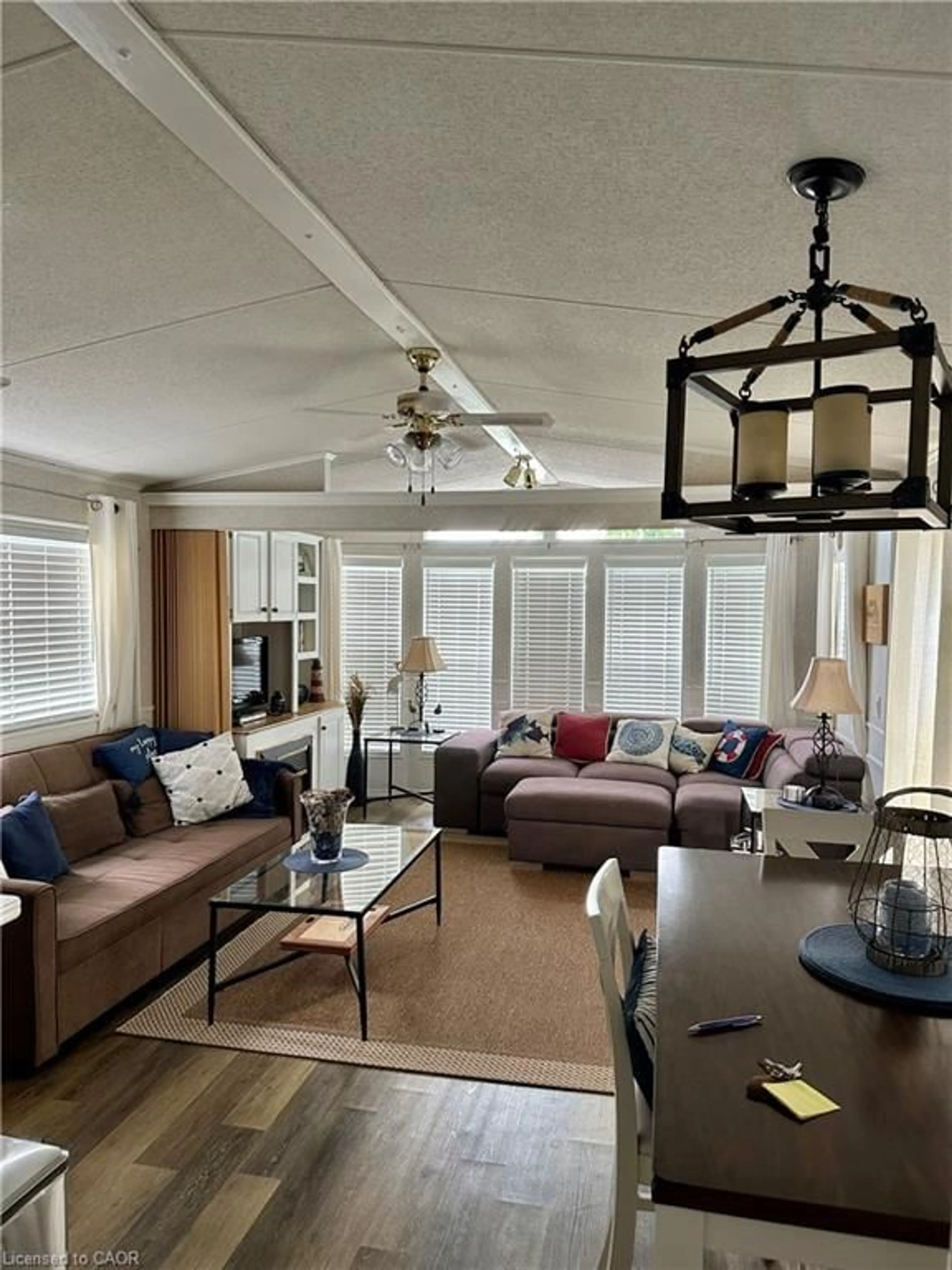 Living room with furniture, wood/laminate floor for 70 Bluewater Ave #91, St. Williams Ontario N0E 1P0
