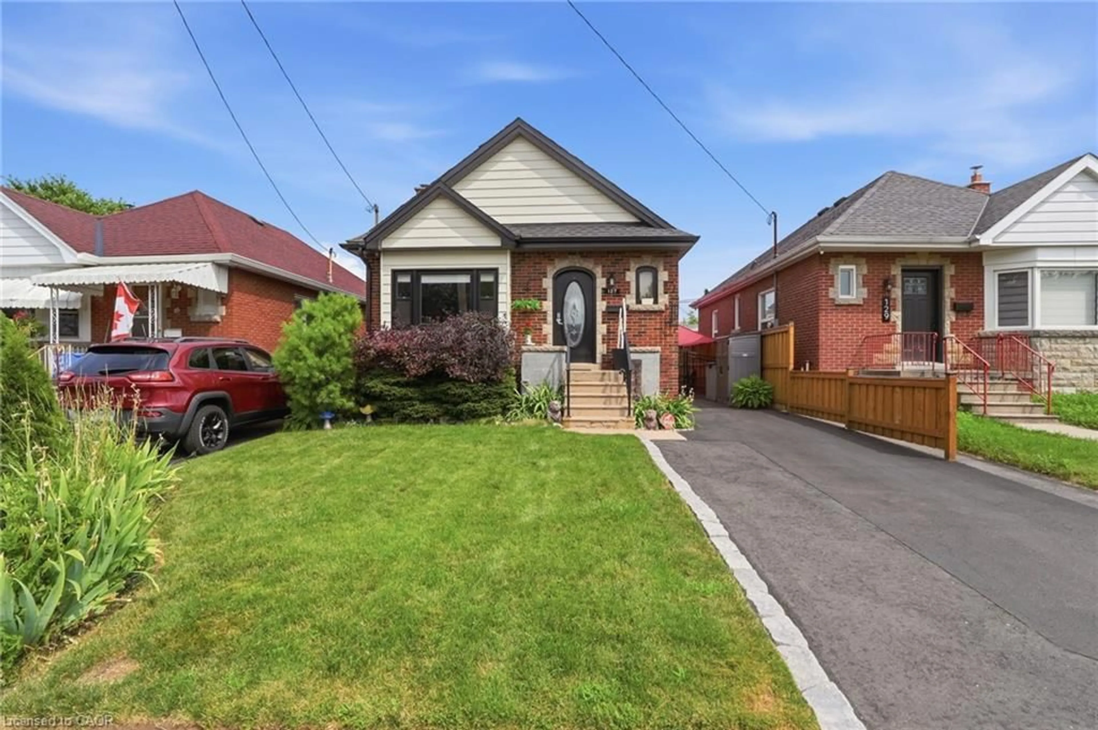 Home with brick exterior material, street for 127 Tragina Ave, Hamilton Ontario L8K 2Z7
