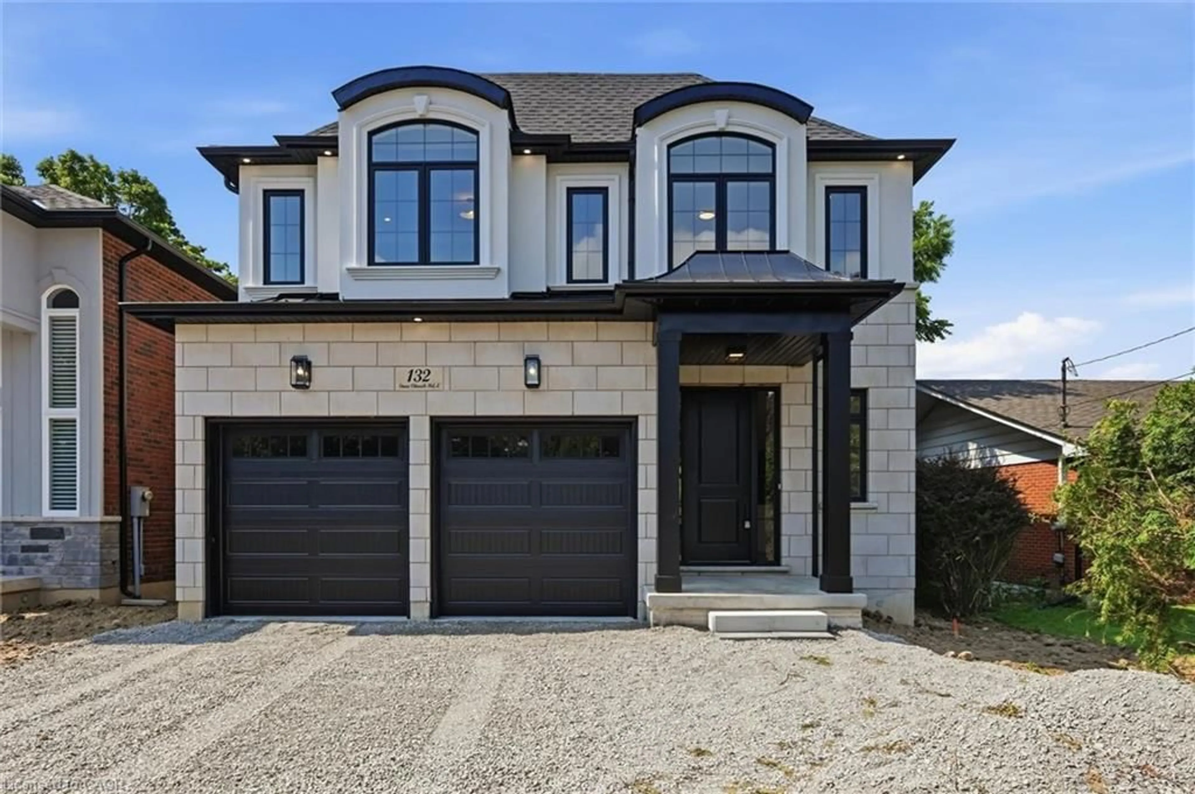 Home with brick exterior material, street for 132 Stone Church Rd, Hamilton Ontario L9B 1A9