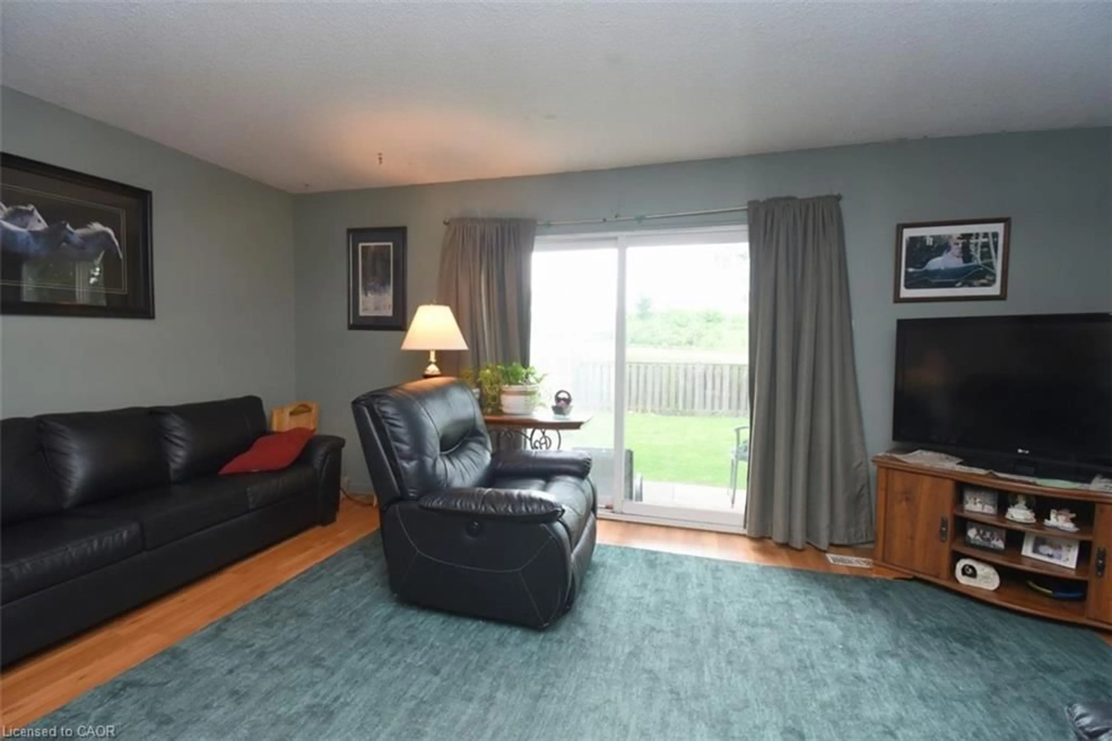 Living room with furniture, wood/laminate floor for 1190 Upper Ottawa St #41, Hamilton Ontario L8W 1T8