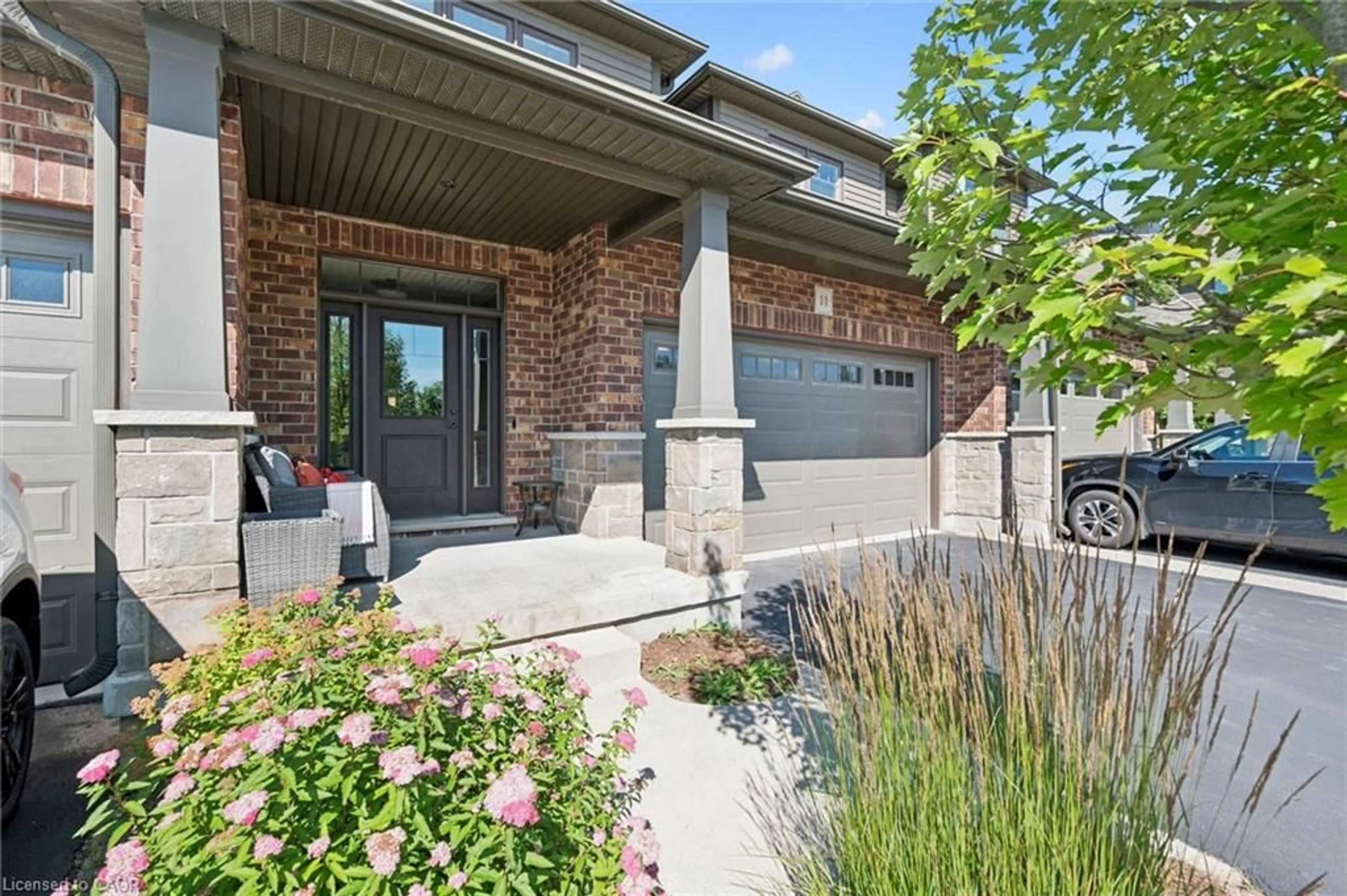 Home with brick exterior material, street for 254 Gosling Gardens Ave #11, Guelph Ontario N1L 0M4