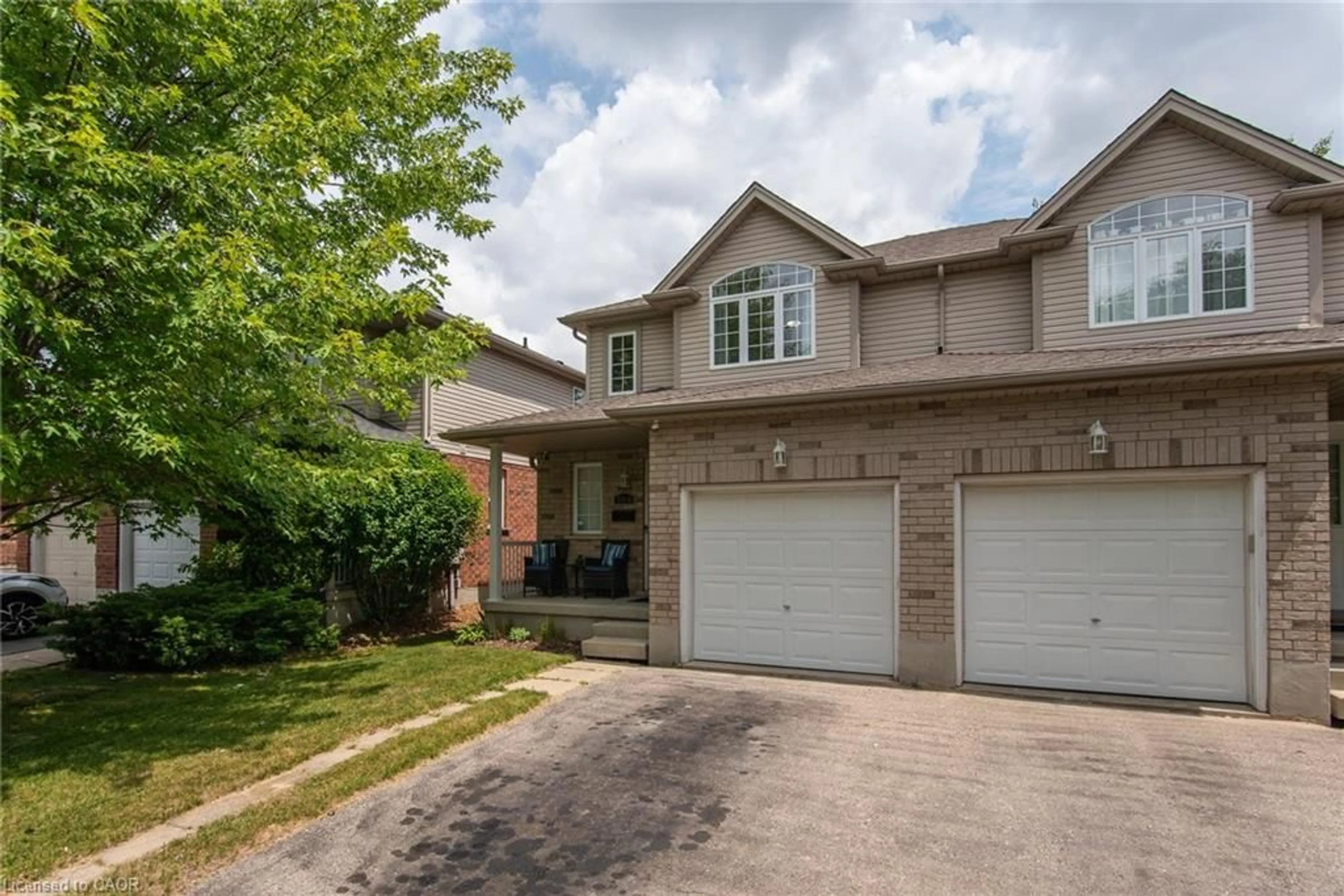 Home with brick exterior material, street for 384 Pastern Trail, Waterloo Ontario N2K 4K7