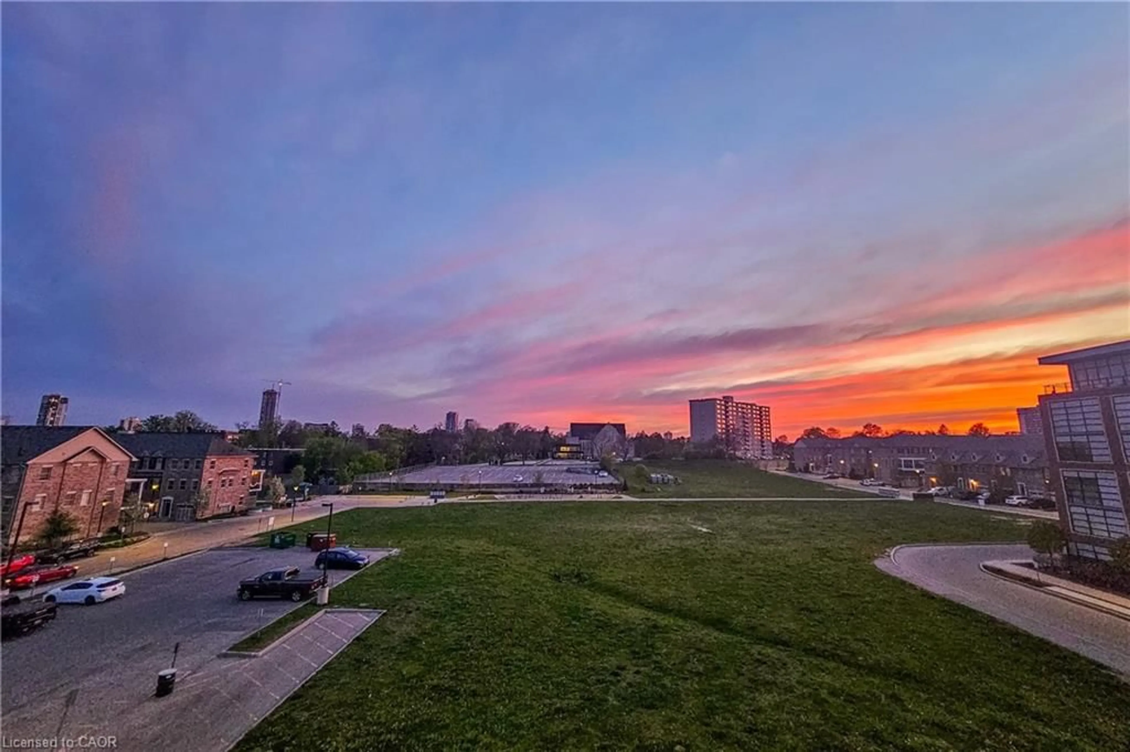 A pic from outside/outdoor area/front of a property/back of a property/a pic from drone, city buildings view from balcony for 155 St Leger St #412, Kitchener Ontario N2H 0B9