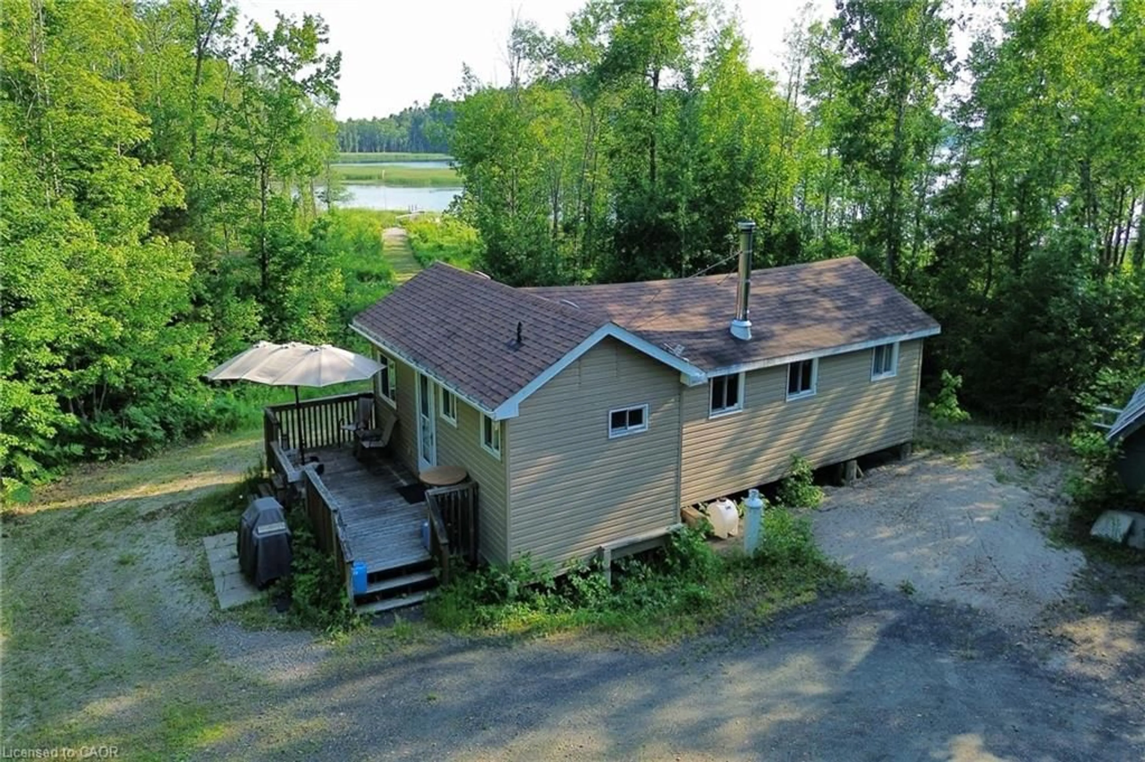 A pic from outside/outdoor area/front of a property/back of a property/a pic from drone, water/lake/river/ocean view for 344 Brennan Harbour Rd, Spanish Ontario P0P 2A0