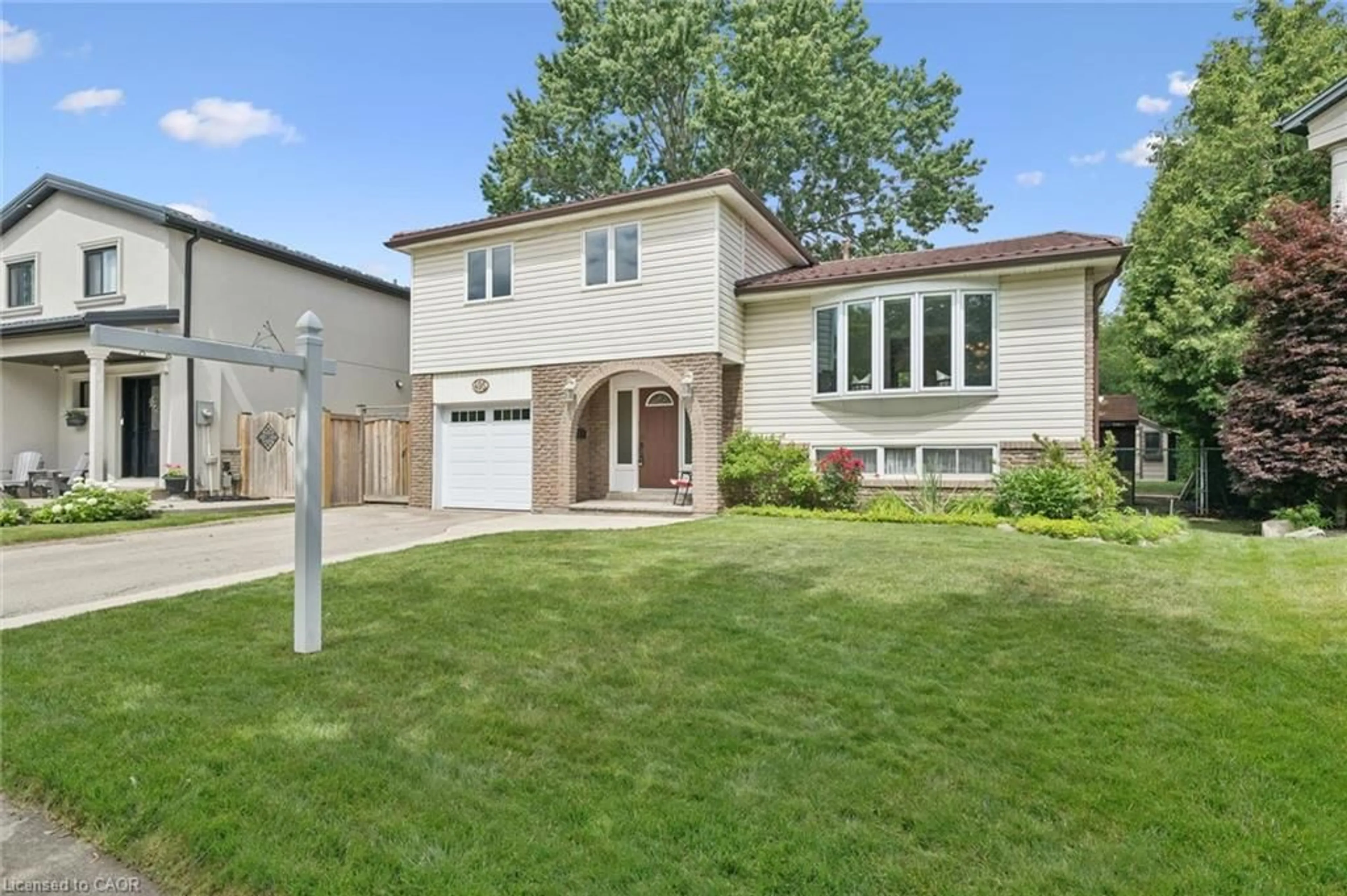 Home with brick exterior material, street for 495 Tipperton Cres, Oakville Ontario L6L 5E1