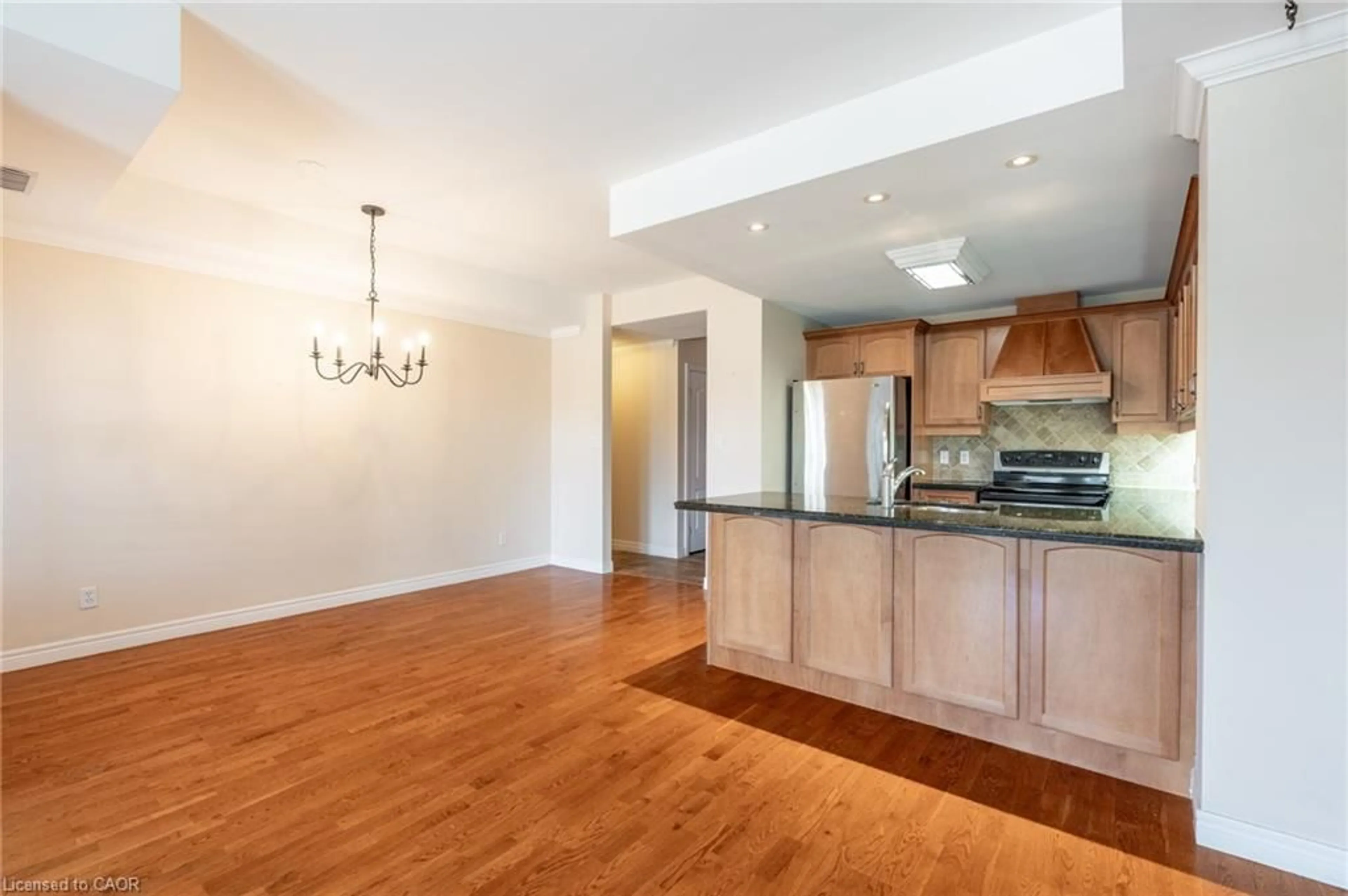 Open concept kitchen, wood/laminate floor for 59 Critzia Dr #314, Mount Hope Ontario L0R 1W0